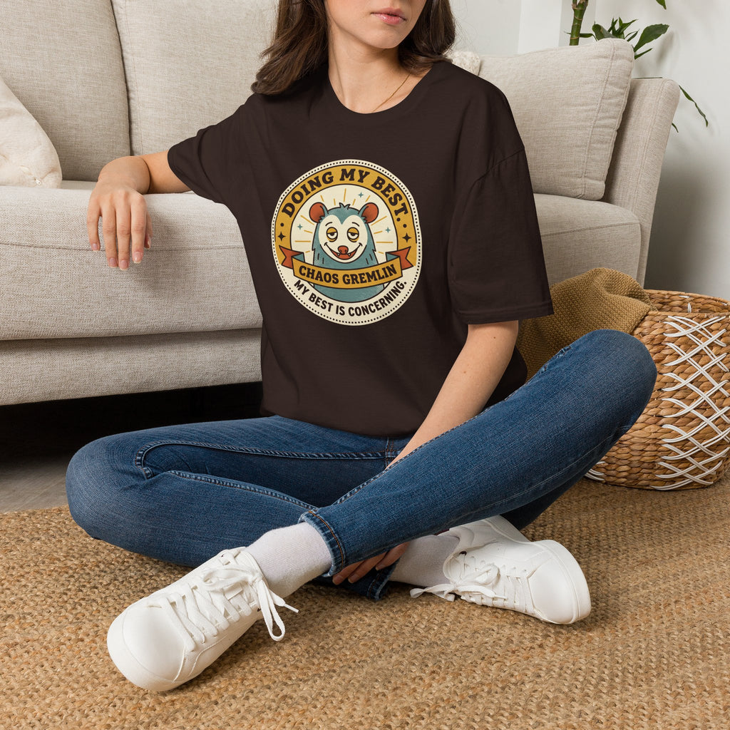 Dark brown Chaos Gremlin graphic T-shirt with circular mascot logo on chest