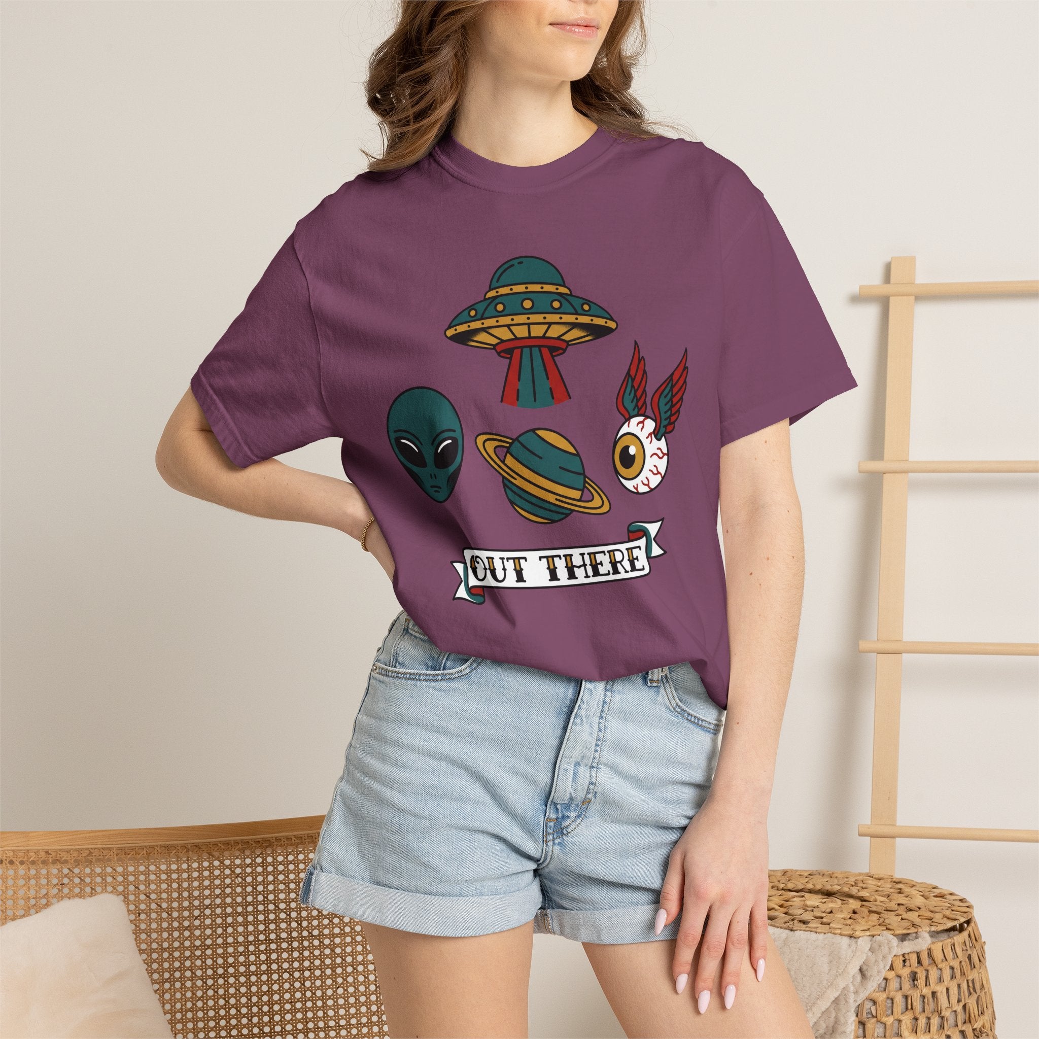 Dark plum crew-neck T-shirt with alien, UFO, cat graphic and OUT THERE banner