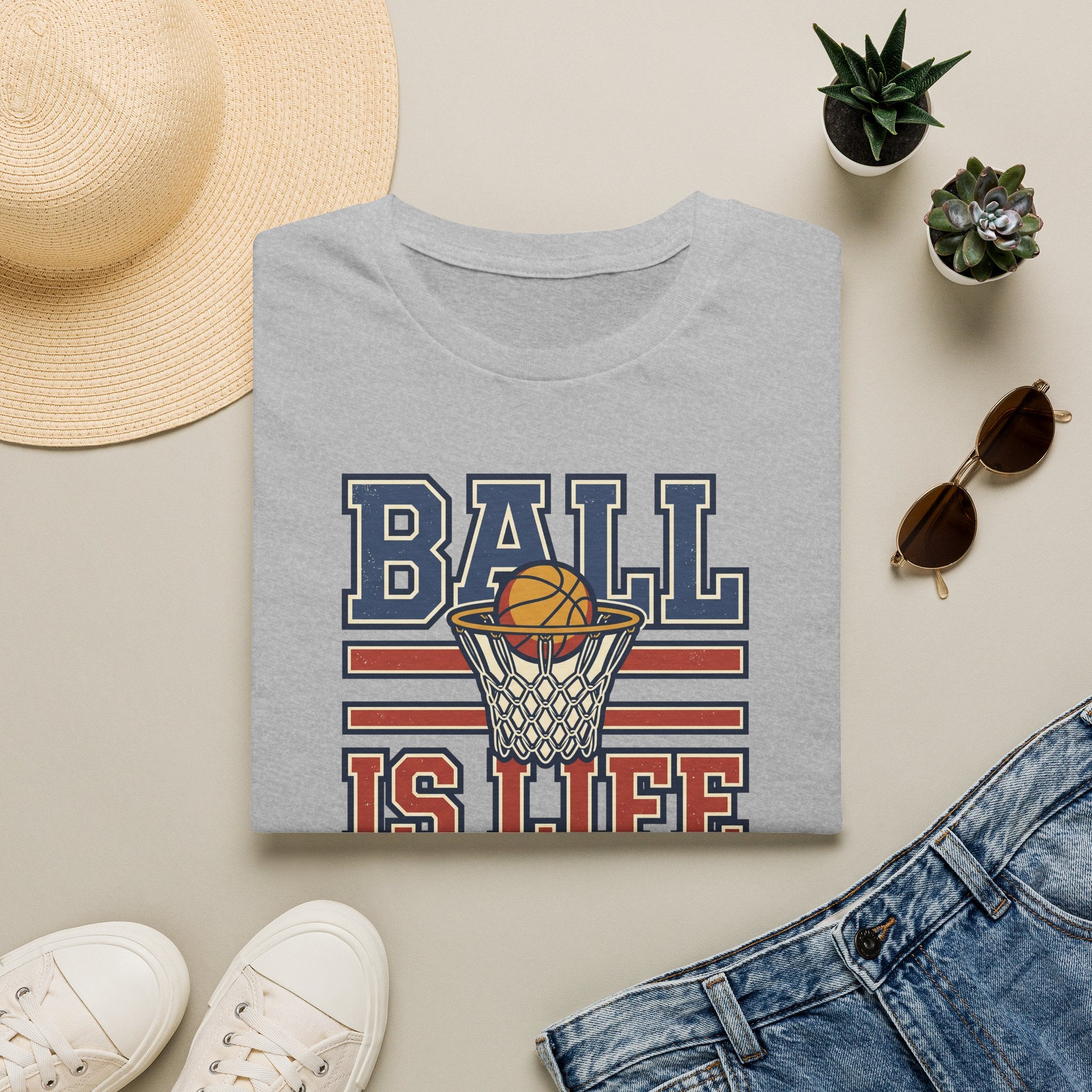 Light gray basketball T-shirt with hoop graphic and text "BALL IS LIFE"