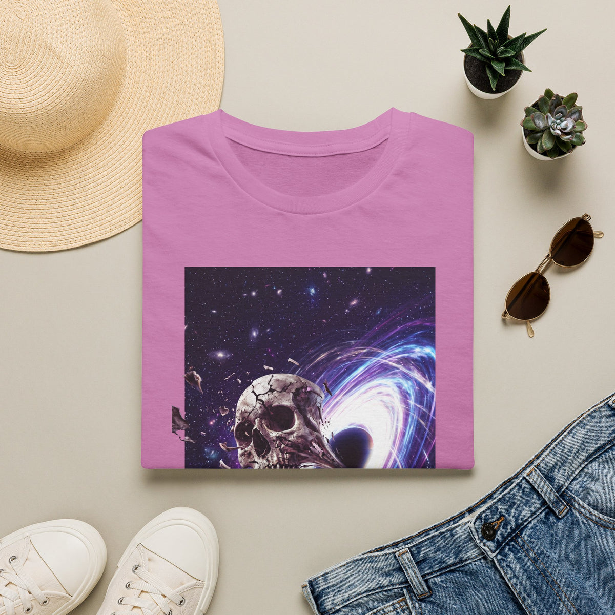 Pink crew-neck t-shirt with skull and galaxy swirl portal graphic on the front