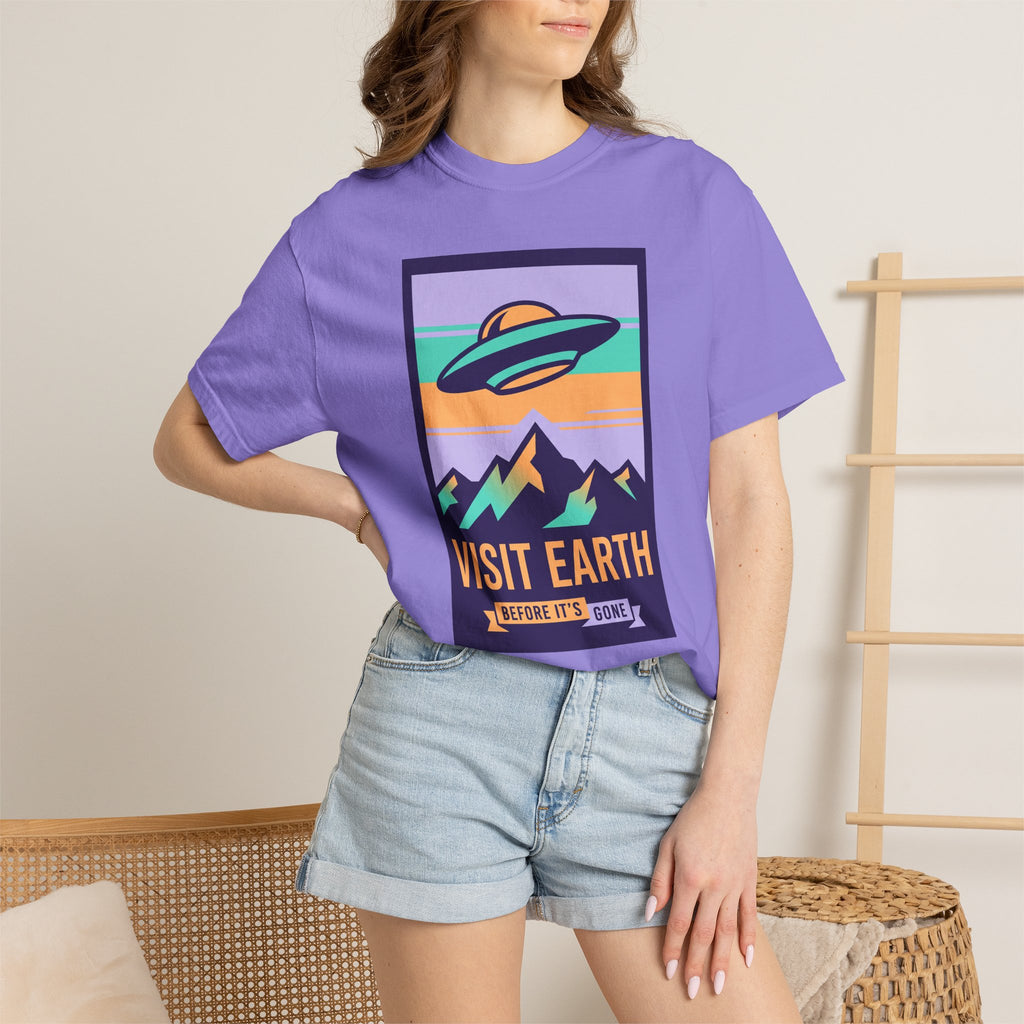 Purple crewneck T-shirt with UFO 'Visit Earth' graphic on front