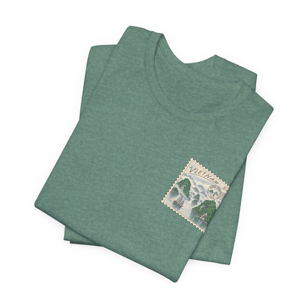Folded green short-sleeve T-shirt with postage-stamp style chest graphic