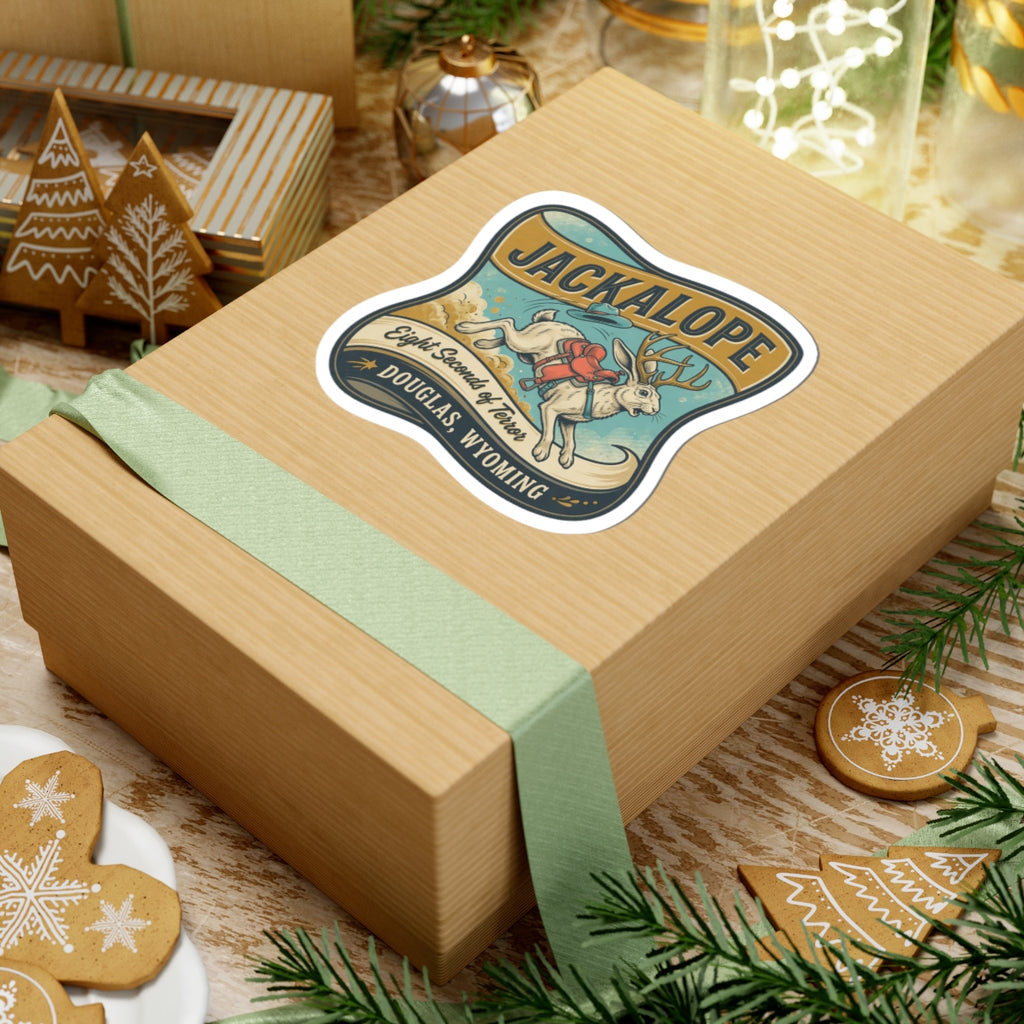 Jackalope sticker on wrapped box showing jackalope, banner text, and dark outline