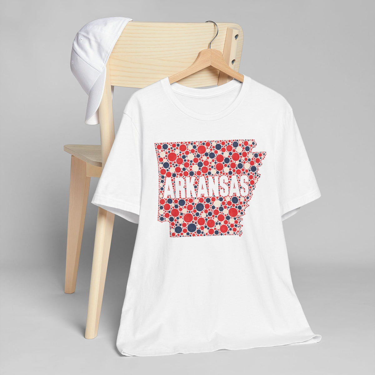 White T-shirt with red and blue floral dot Arkansas outline graphic