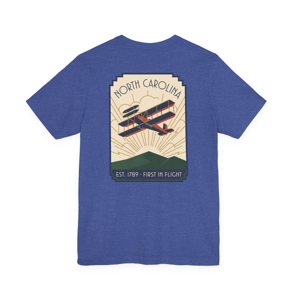 Blue t-shirt with North Carolina biplane graphic and 'Est. 1789 - First in Flight' text