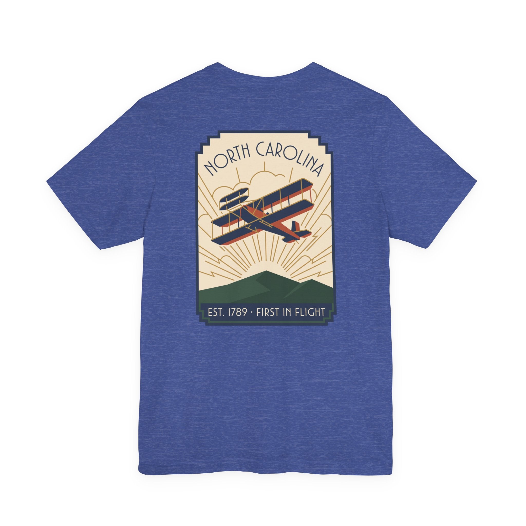 Blue t-shirt with North Carolina biplane graphic and 'Est. 1789 - First in Flight' text