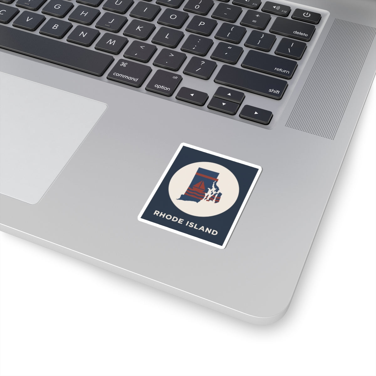 Rhode Island nautical map sticker with state outline and sailboat design on laptop
