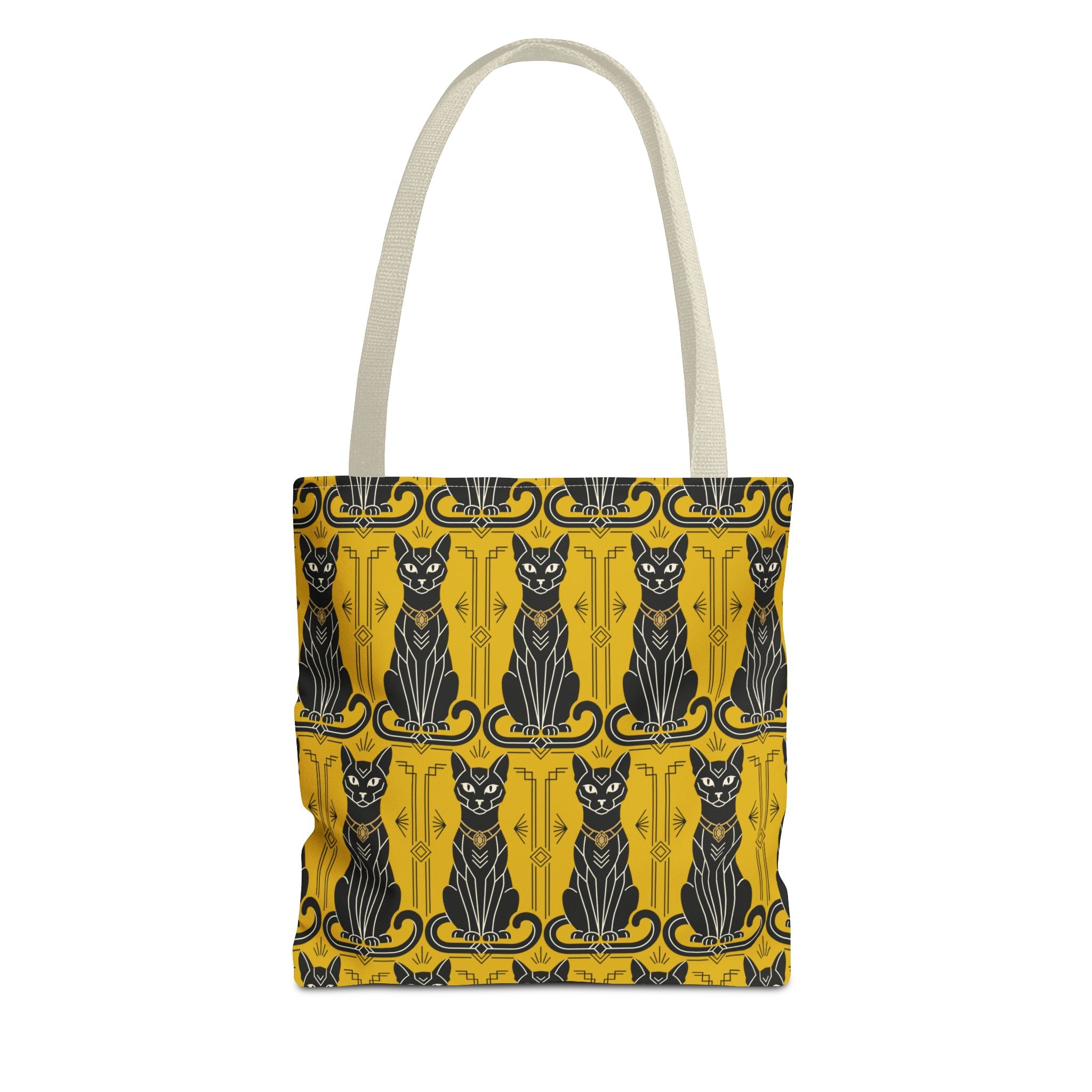 Tote bag with yellow cat print, blue-and-black cat faces, pale gray top handles.
