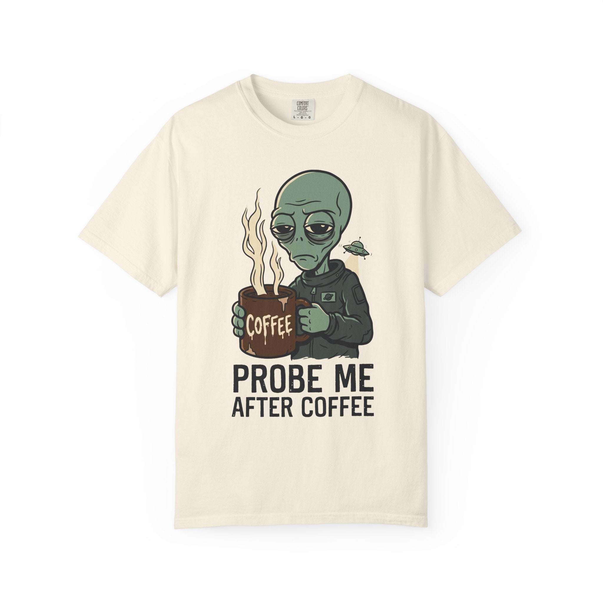 Cream T-shirt with alien holding coffee cup graphic and 'PROBE ME AFTER COFFEE' text.