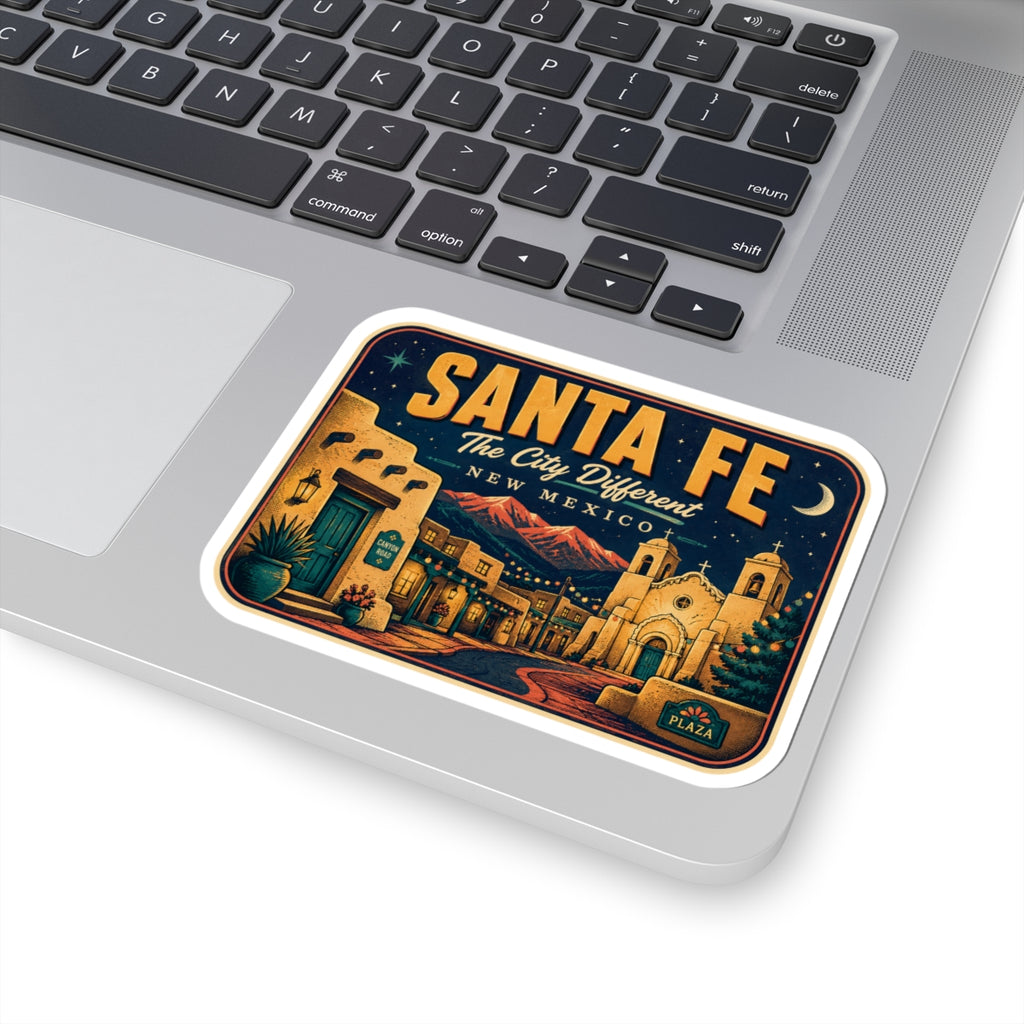 Santa Fe luggage tag sticker on a laptop trackpad, rectangular decal with night sky town.