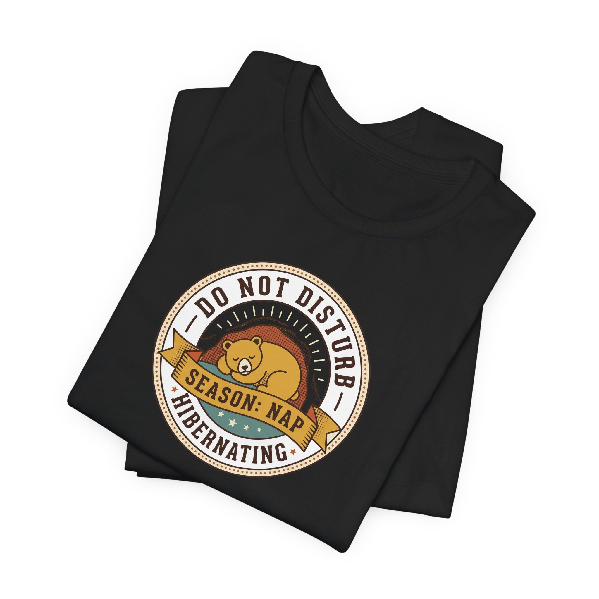 Black T-shirt with round bear sleeping badge graphic on chest