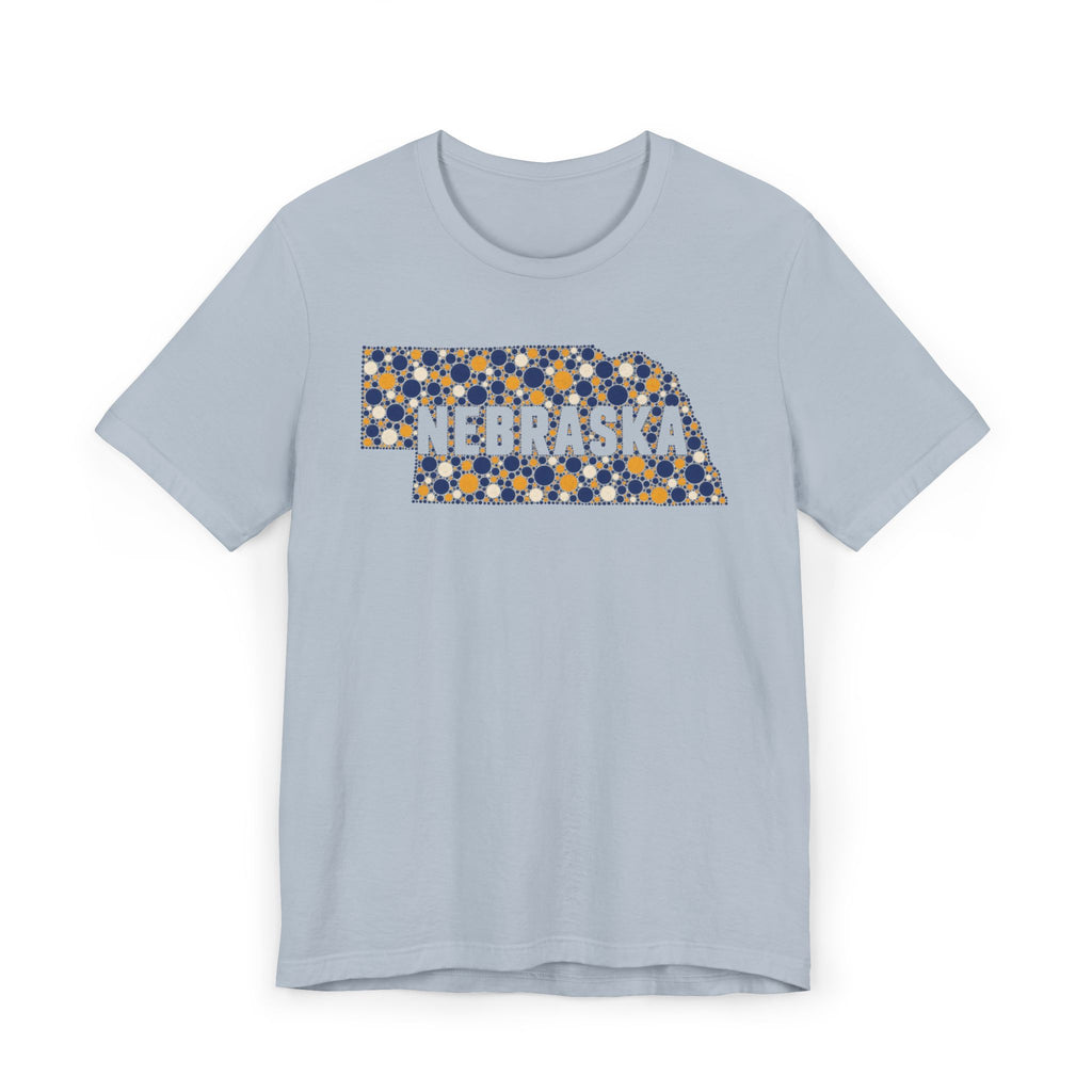 Light blue tee with floral Nebraska outline graphic and NEBRASKA text