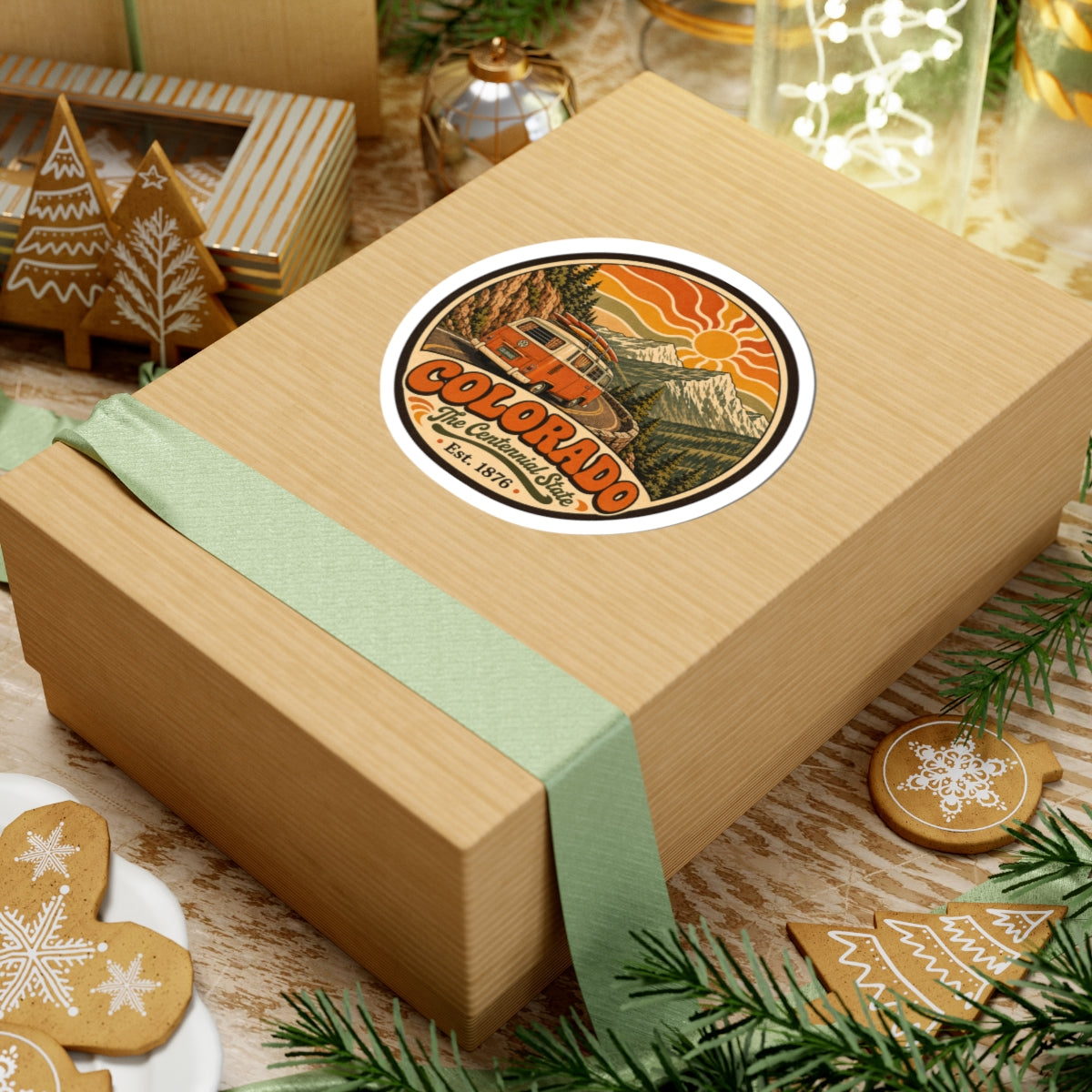 Round Colorado camper van decal on a gift box wrapped with green ribbon