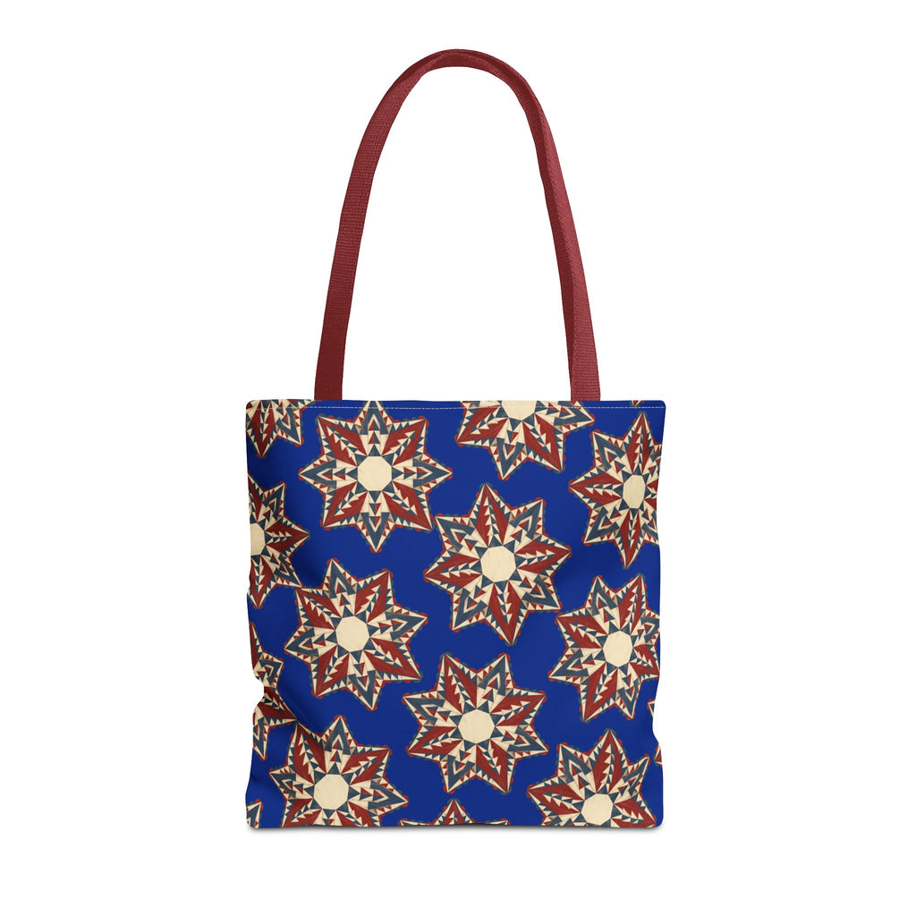 Blue tote bag with starburst floral pattern and dark red handles
