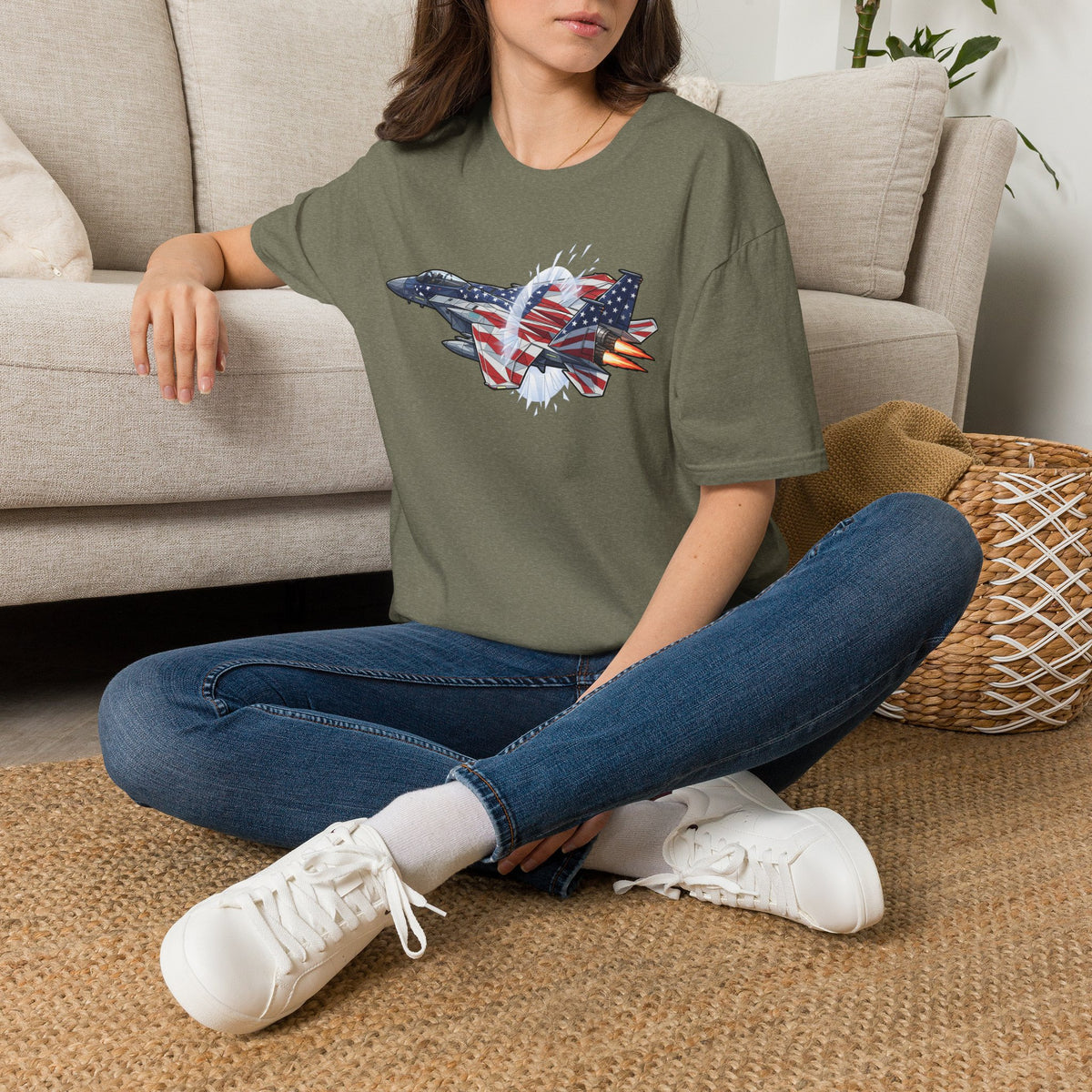 Heather military green fighter jet graphic T-shirt worn on a model, front view