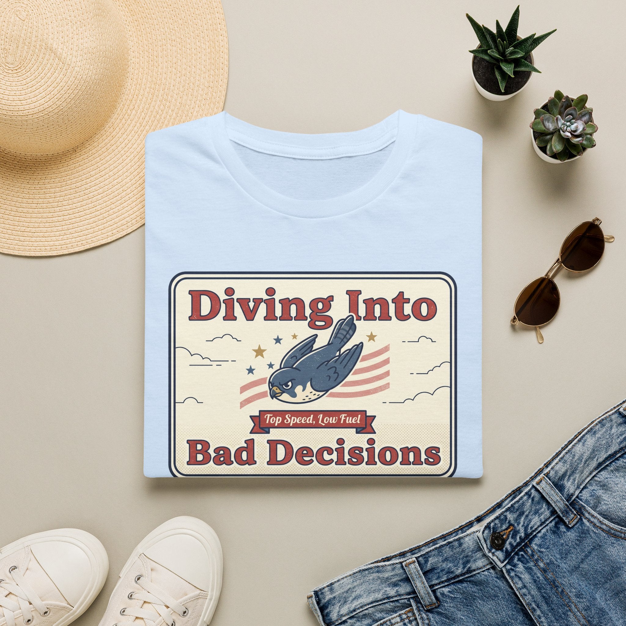 Light blue graphic T-shirt with retro shark and “Diving Into Bad Decisions” text