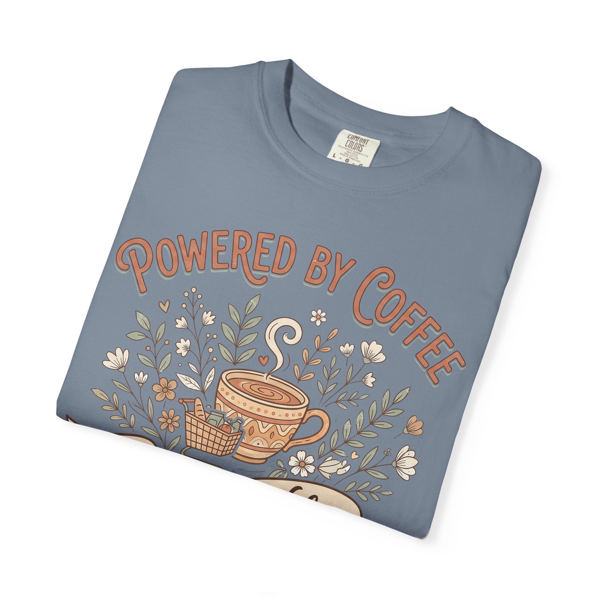 Blue-gray T-shirt with Powered by Coffee text and coffee cup floral graphic