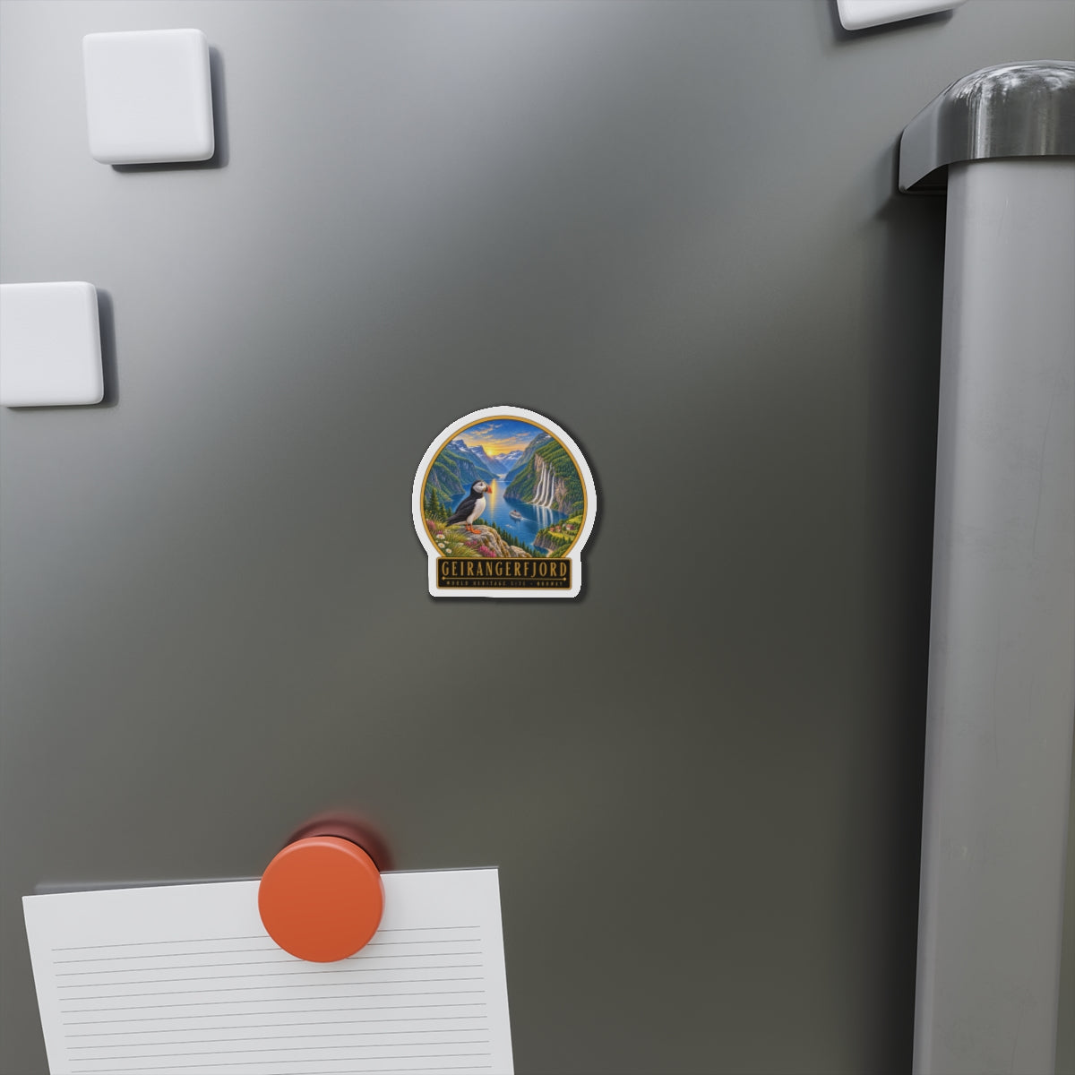 Die-cut vinyl fridge magnet on metal fridge door with Geirangerfjord puffin design