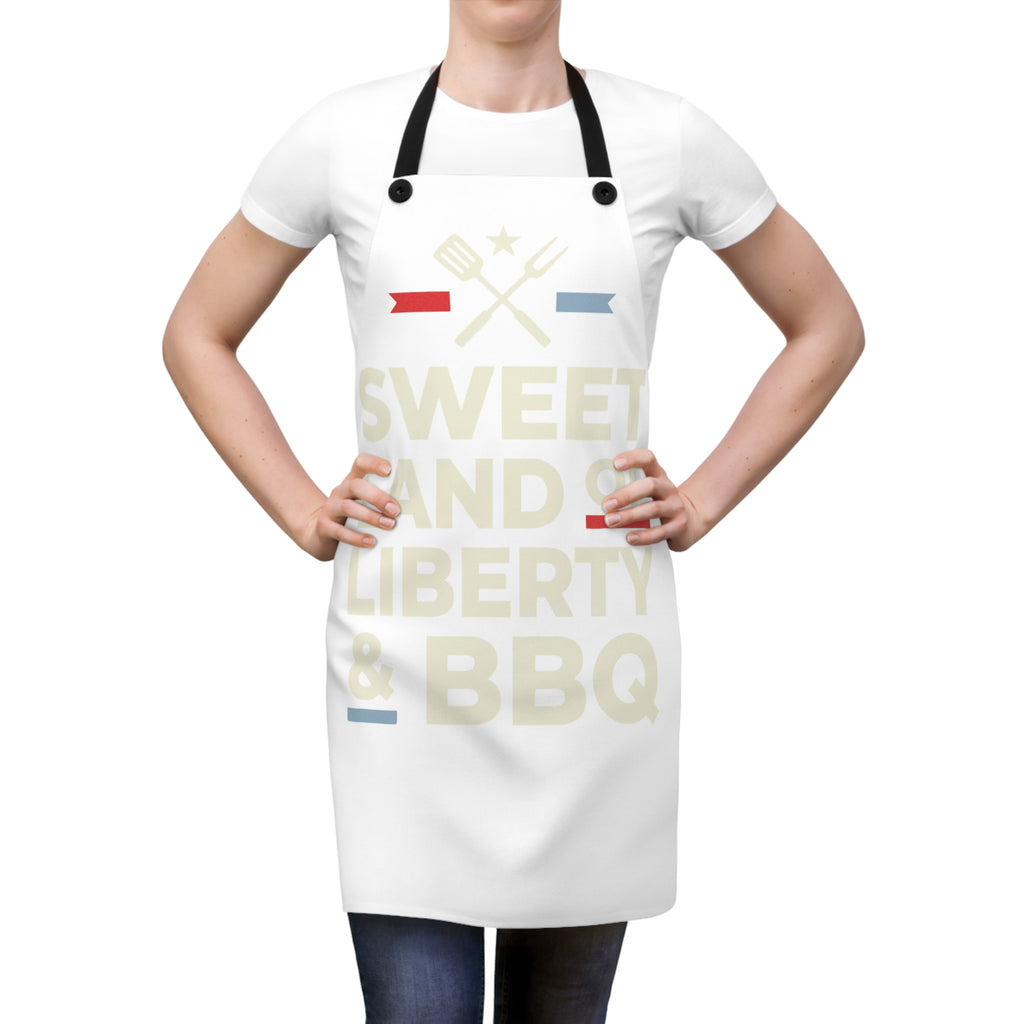 White grilling apron on model with black straps and 'Sweet Land of Liberty & BBQ' graphic