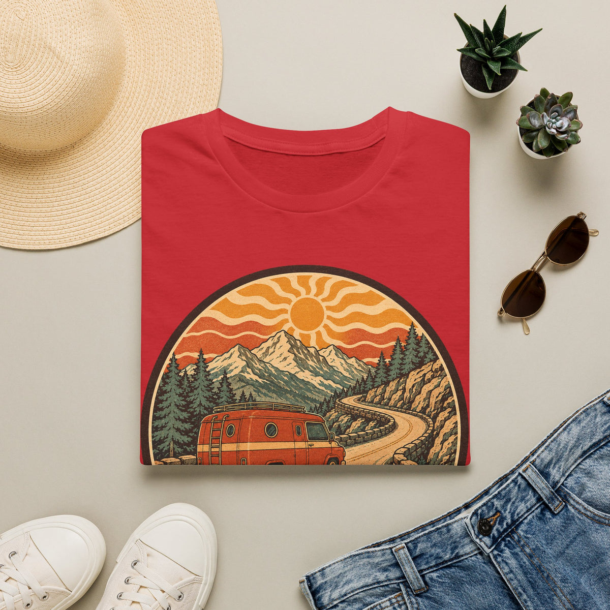 Unisex T-shirt in red with crew neck and mountain sunset van graphic on front.