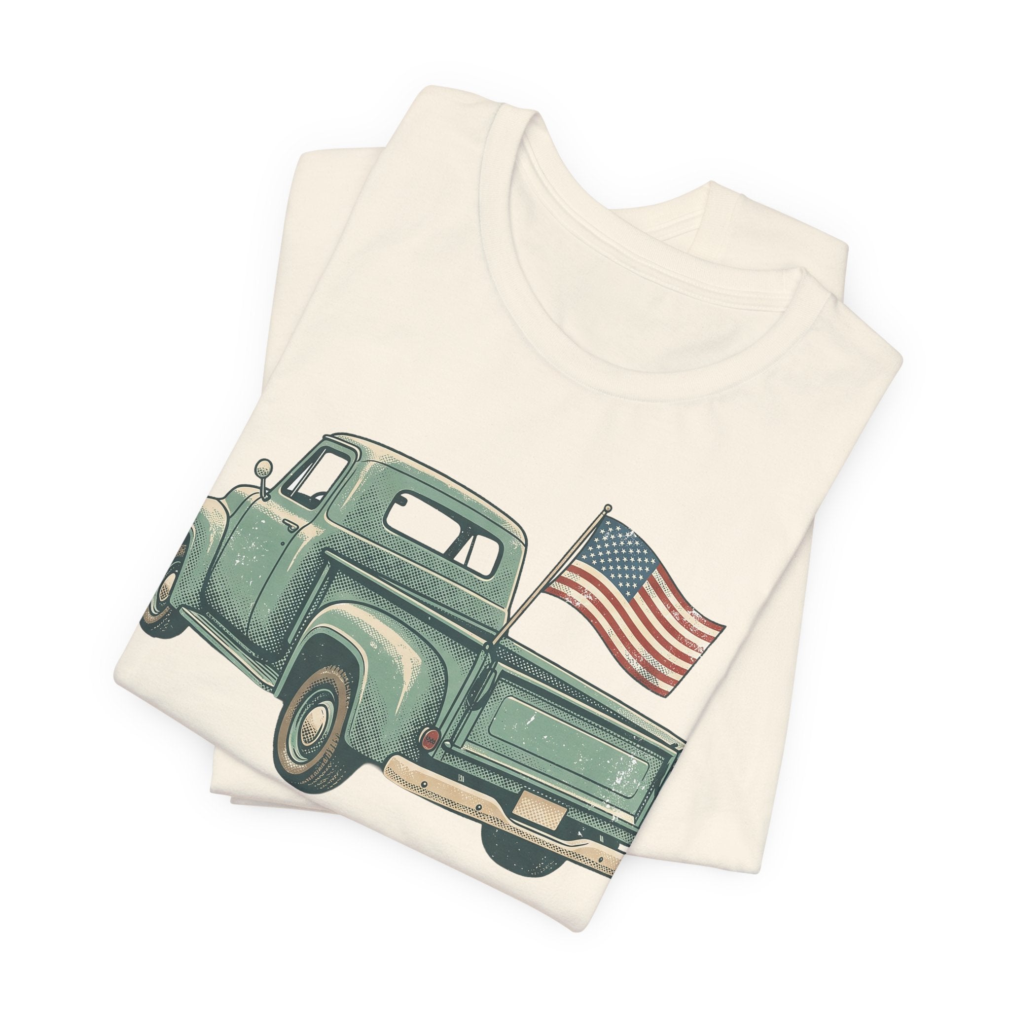 Cream T-shirt with green vintage pickup truck and U.S. flag graphic on front