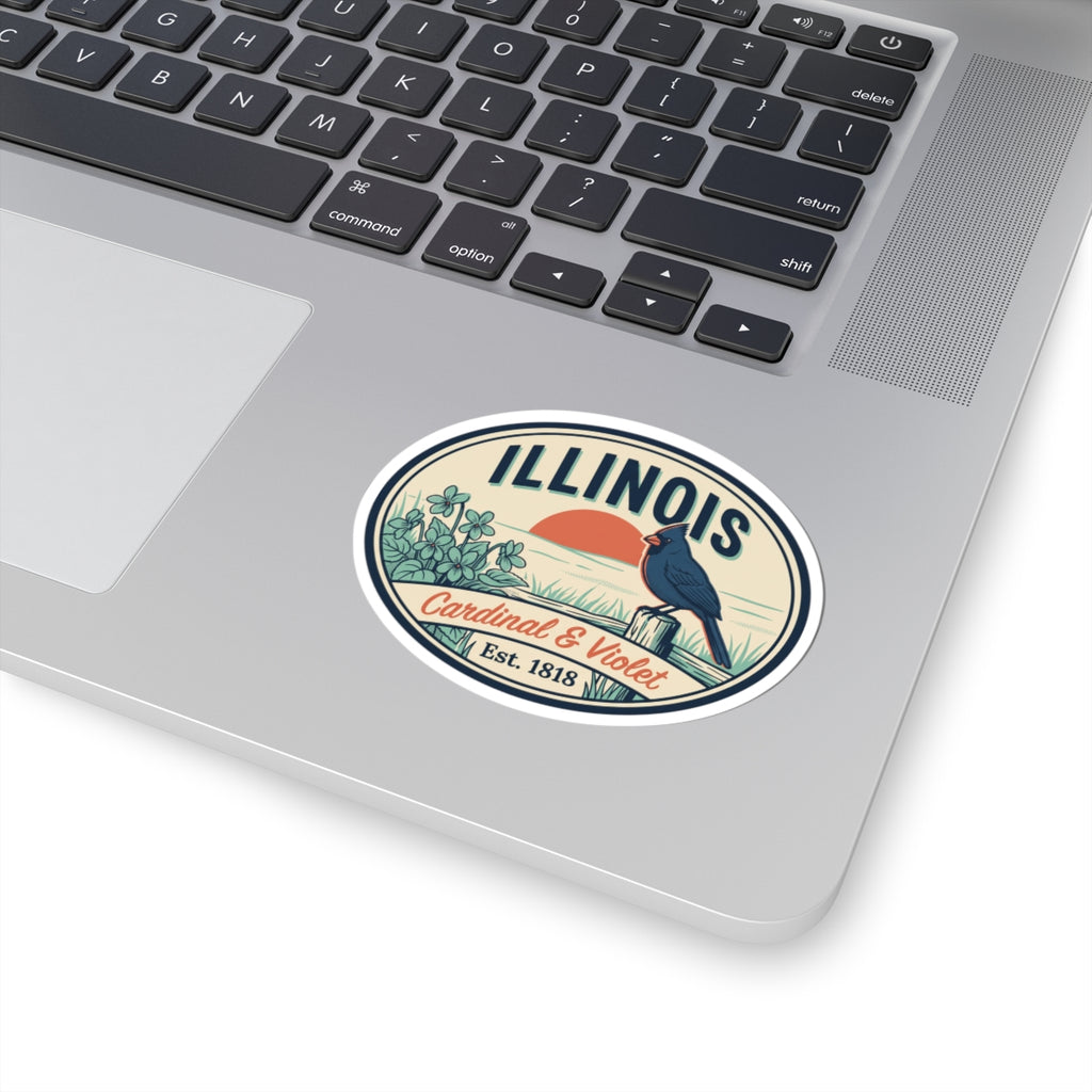 Oval vinyl sticker decal on laptop showing Illinois cardinal and violet badge