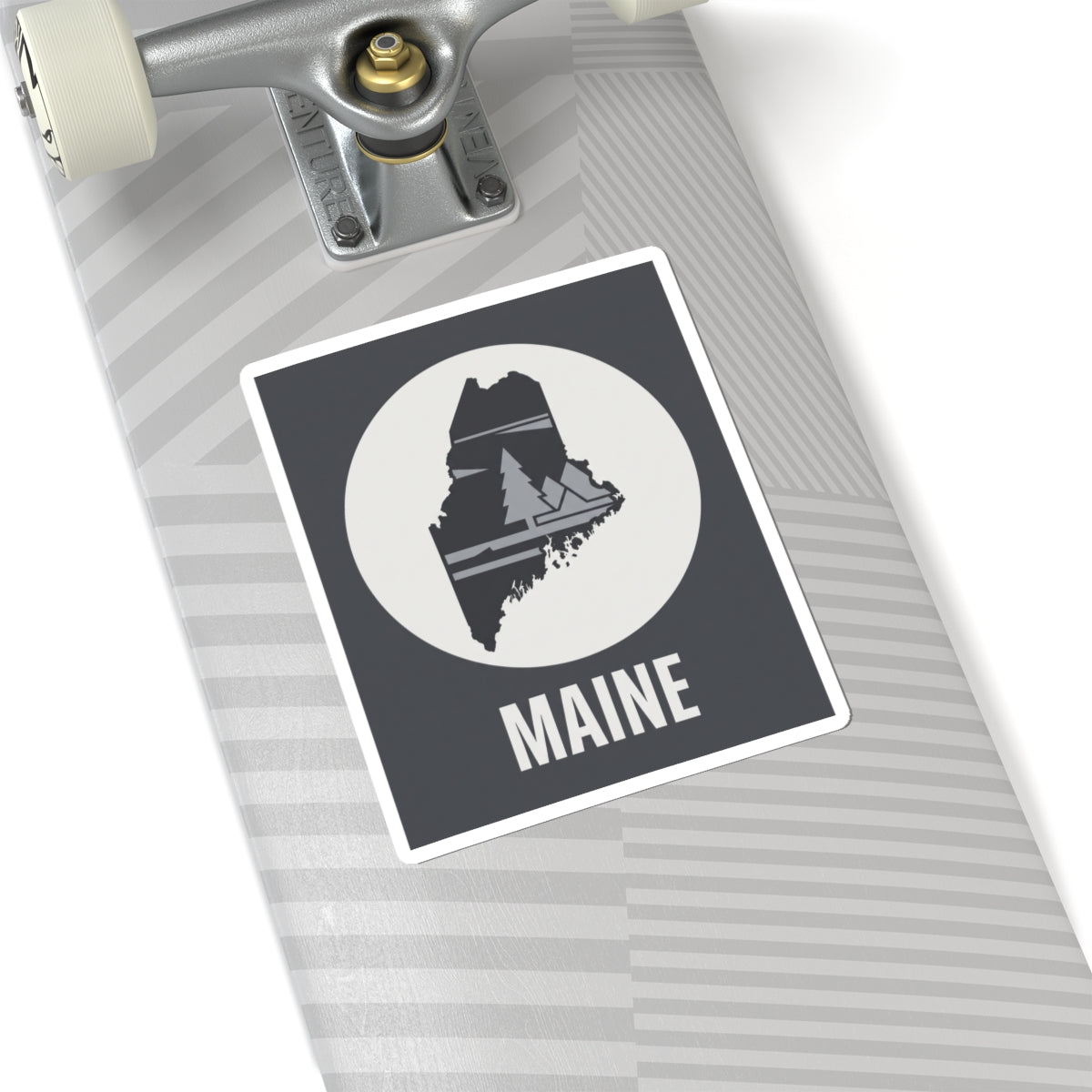 Rectangular Maine state sticker with circular emblem, dark background, pine tree map and 'MAINE'.
