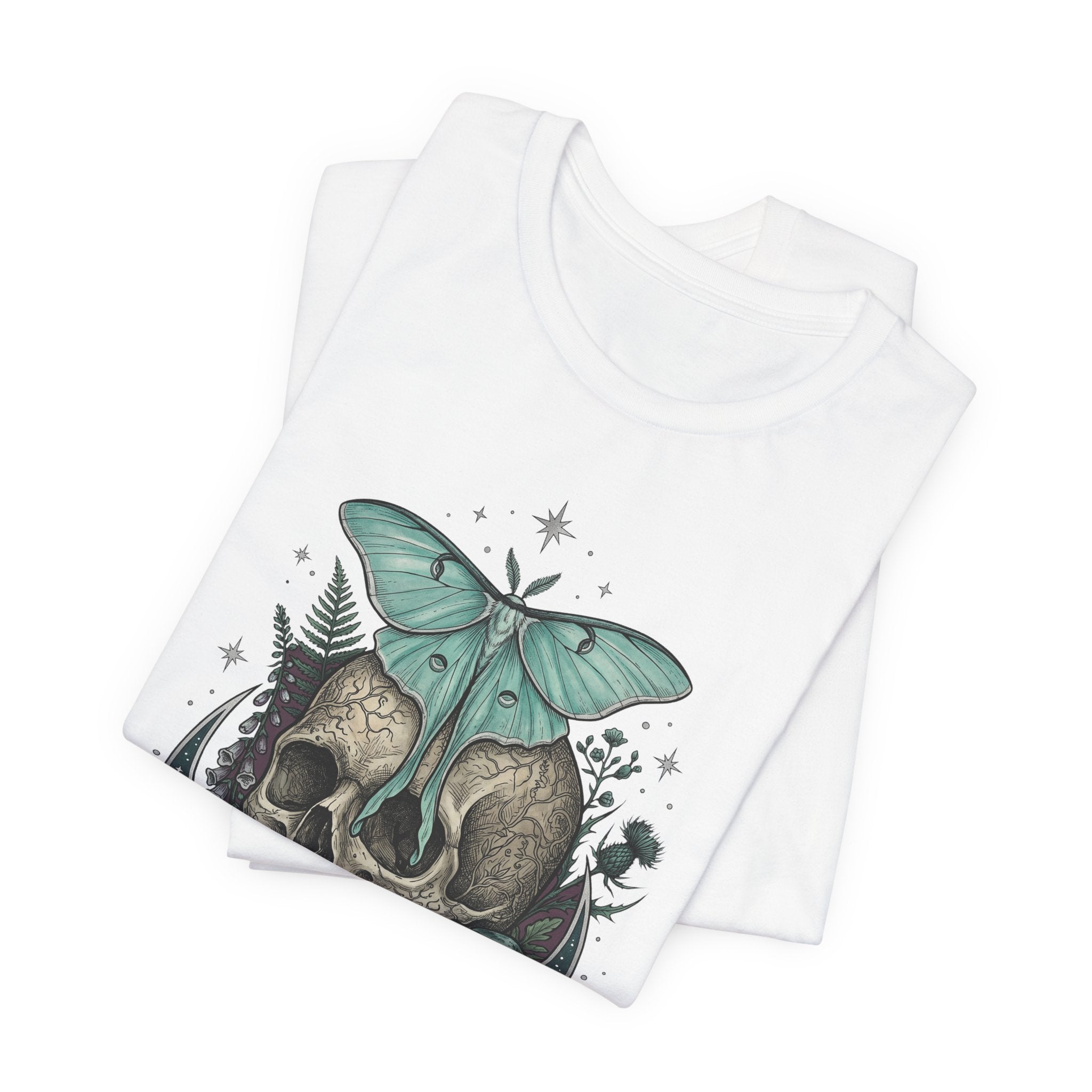White unisex T-shirt with teal moth-and-skull graphic on front, layered view