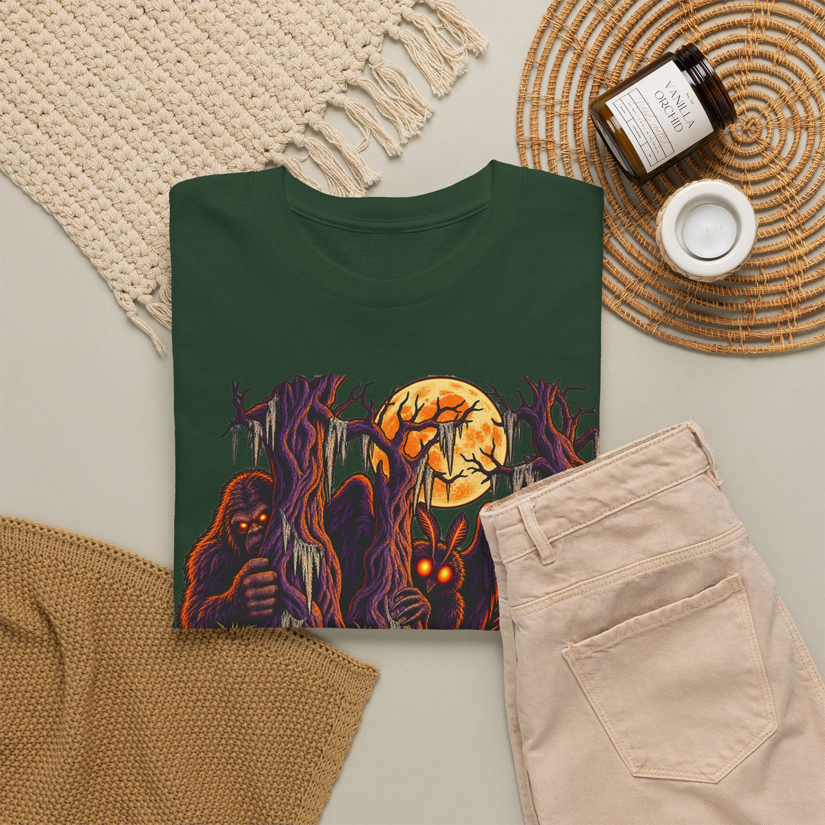 Dark green T-shirt with haunted monster and moon graphic, crew neck.