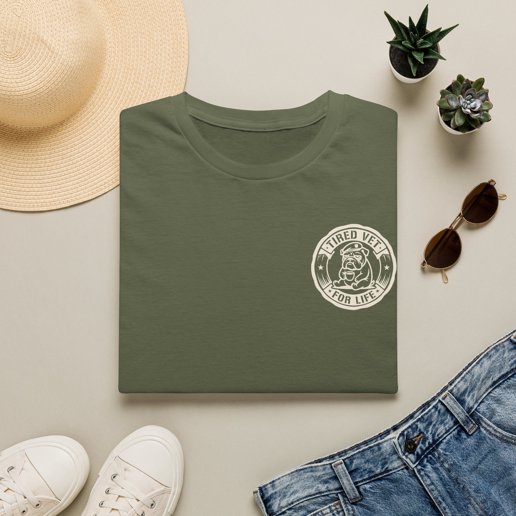 Green t-shirt with small chest circular graphic logo print on crew neck