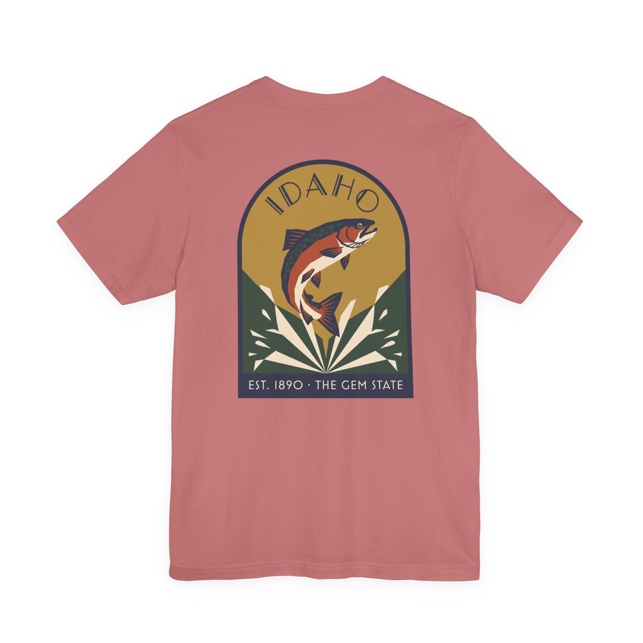 Rose pink crewneck t-shirt with circular Idaho trout badge graphic and "EST. 1890 • THE GEM STATE" text.