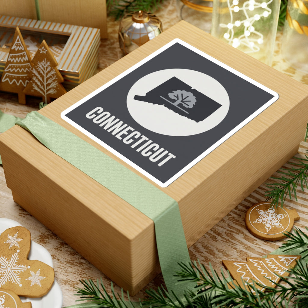 Connecticut tree silhouette kiss-cut sticker on a wrapped gift, dark square with white circle