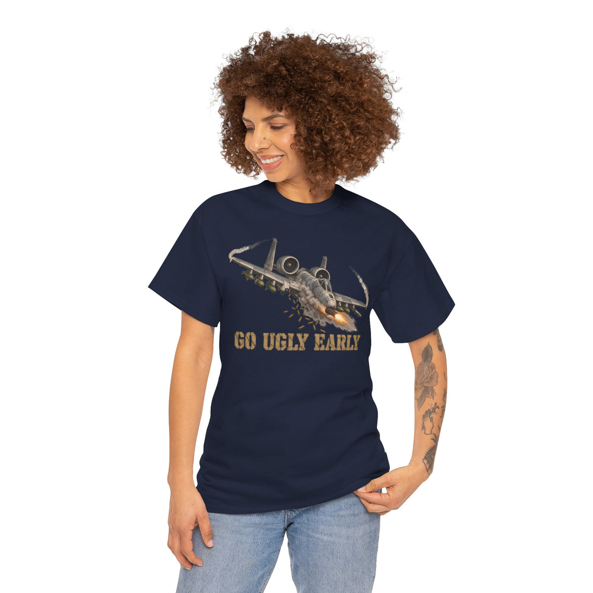 Navy crew-neck T-shirt worn by model with jet graphic and “GO UGLY EARLY” text