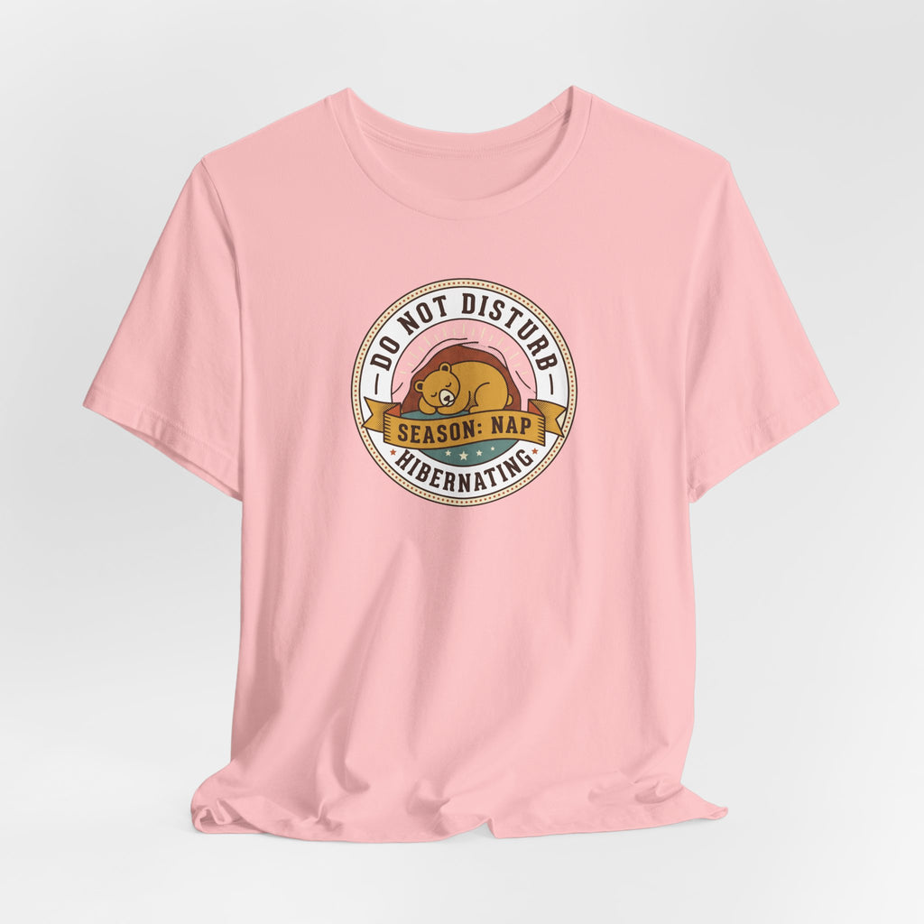 Pink short-sleeve T-shirt with circular “Do Not Disturb” sleeping bear graphic