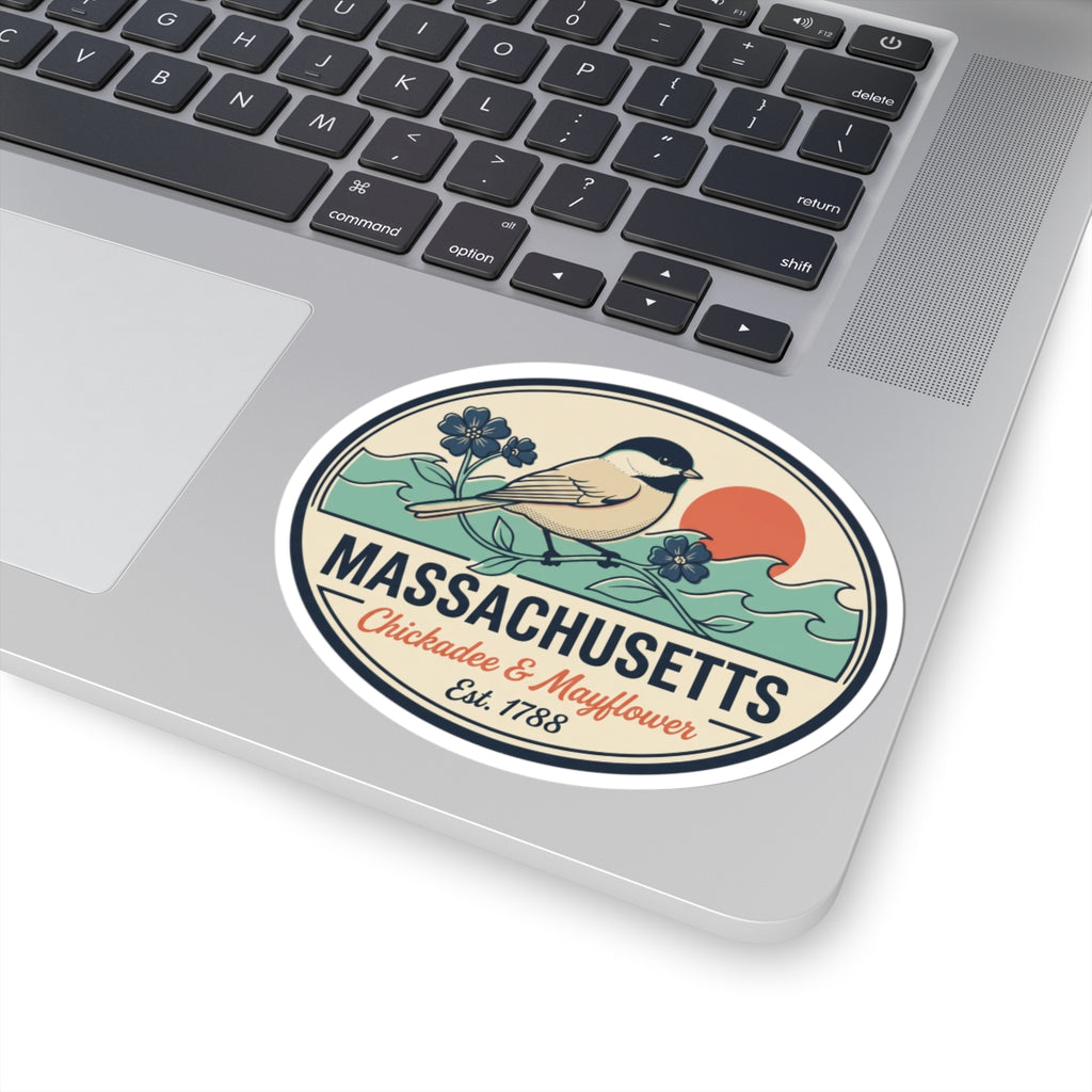 Round sticker on laptop showing Massachusetts text and chickadee bird illustration