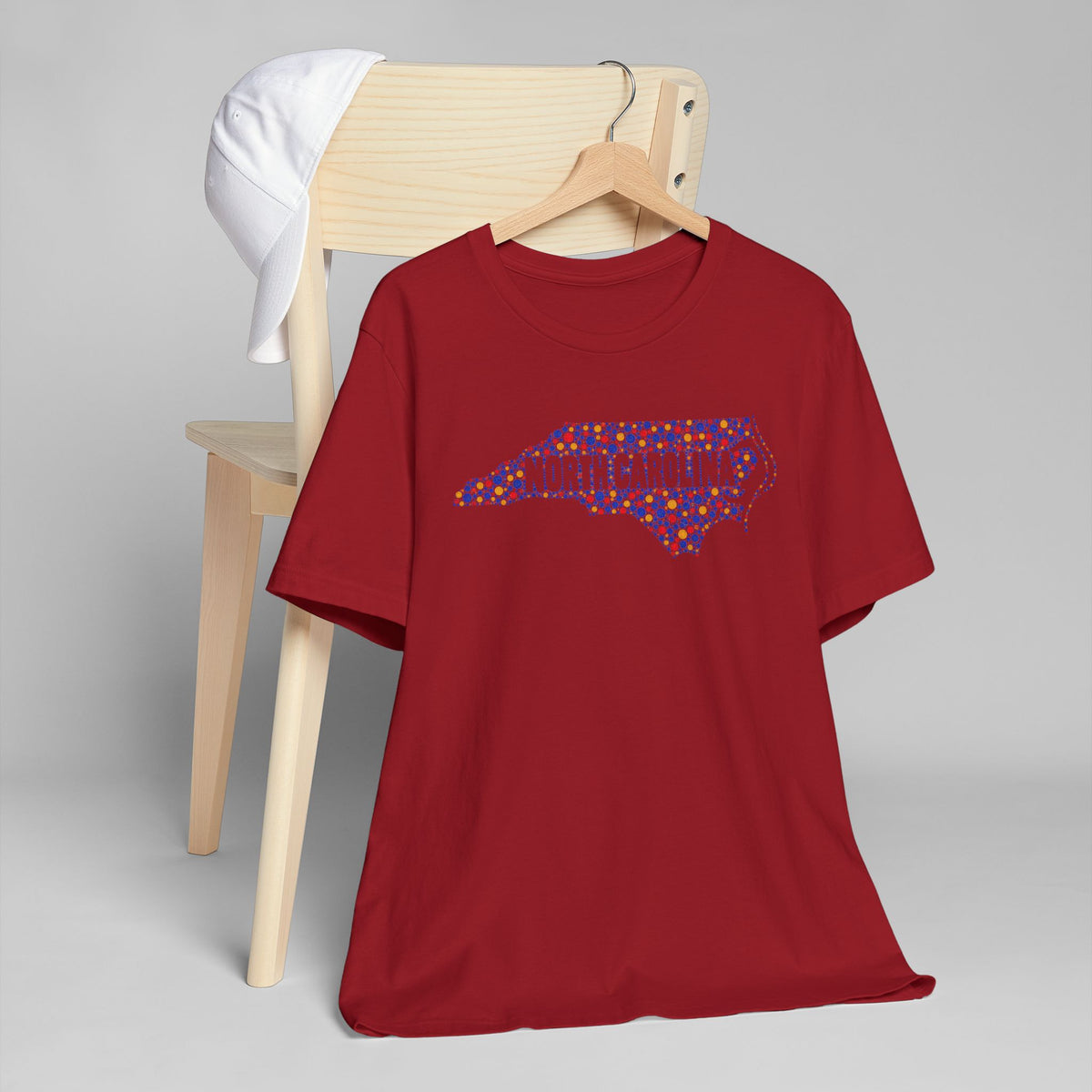 Red crewneck short-sleeve T-shirt with colorful North Carolina map graphic