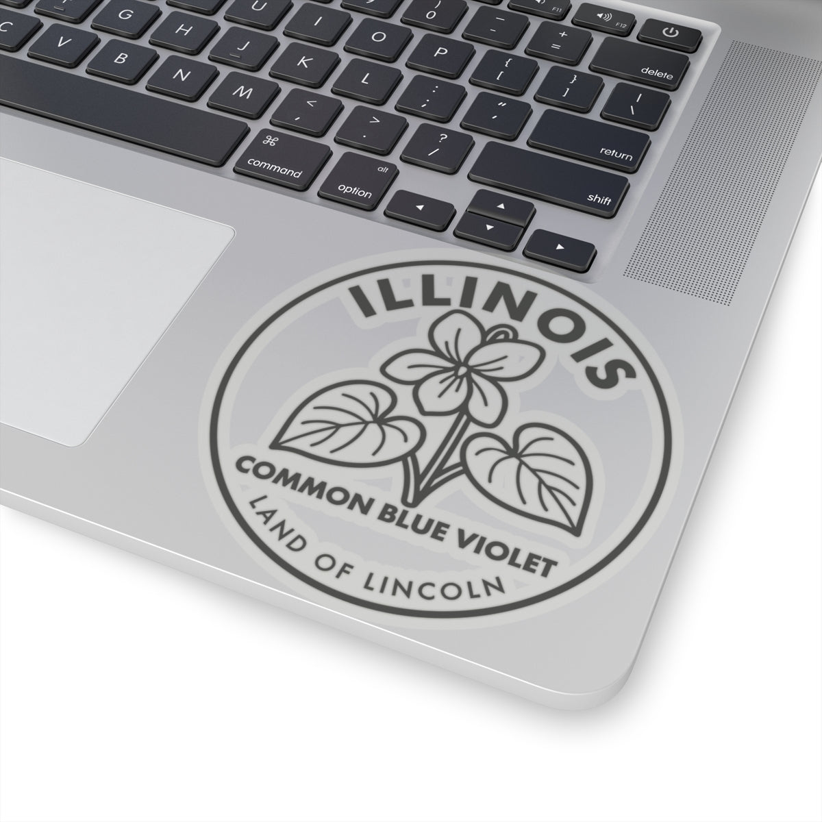 Common blue violet Illinois vinyl decal on laptop lid, circular seal with “LAND OF LINCOLN”