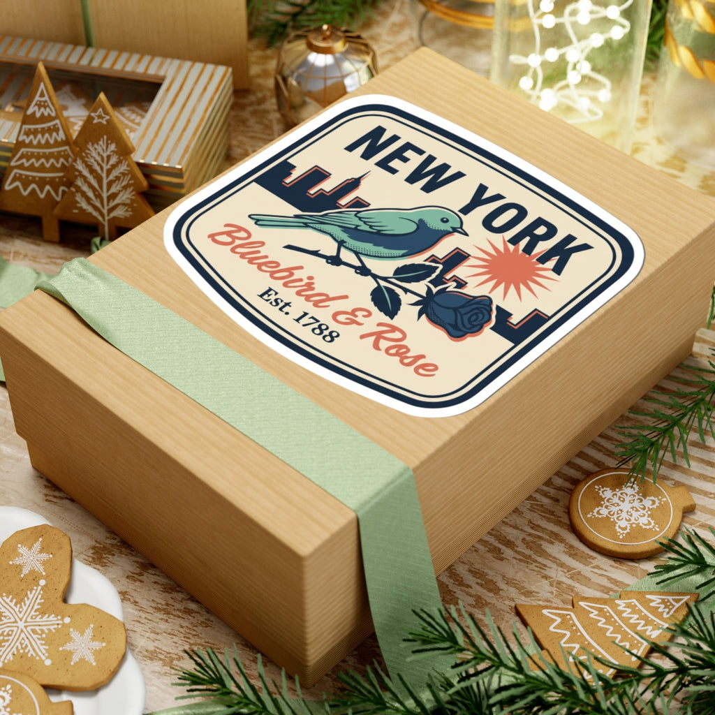 NEW YORK bluebird & rose badge decal on a wrapped gift box