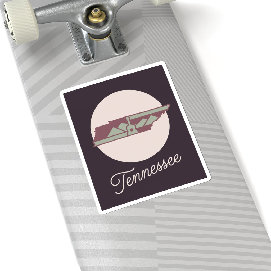 Tennessee state silhouette sticker on striped laptop trackpad area