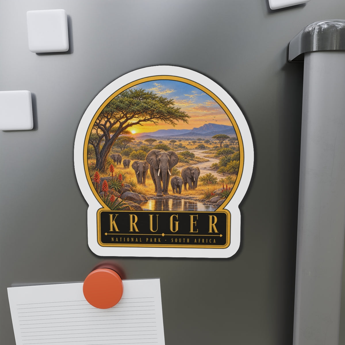 Die-cut vinyl fridge magnet with Kruger emblem over elephant waterhole scene