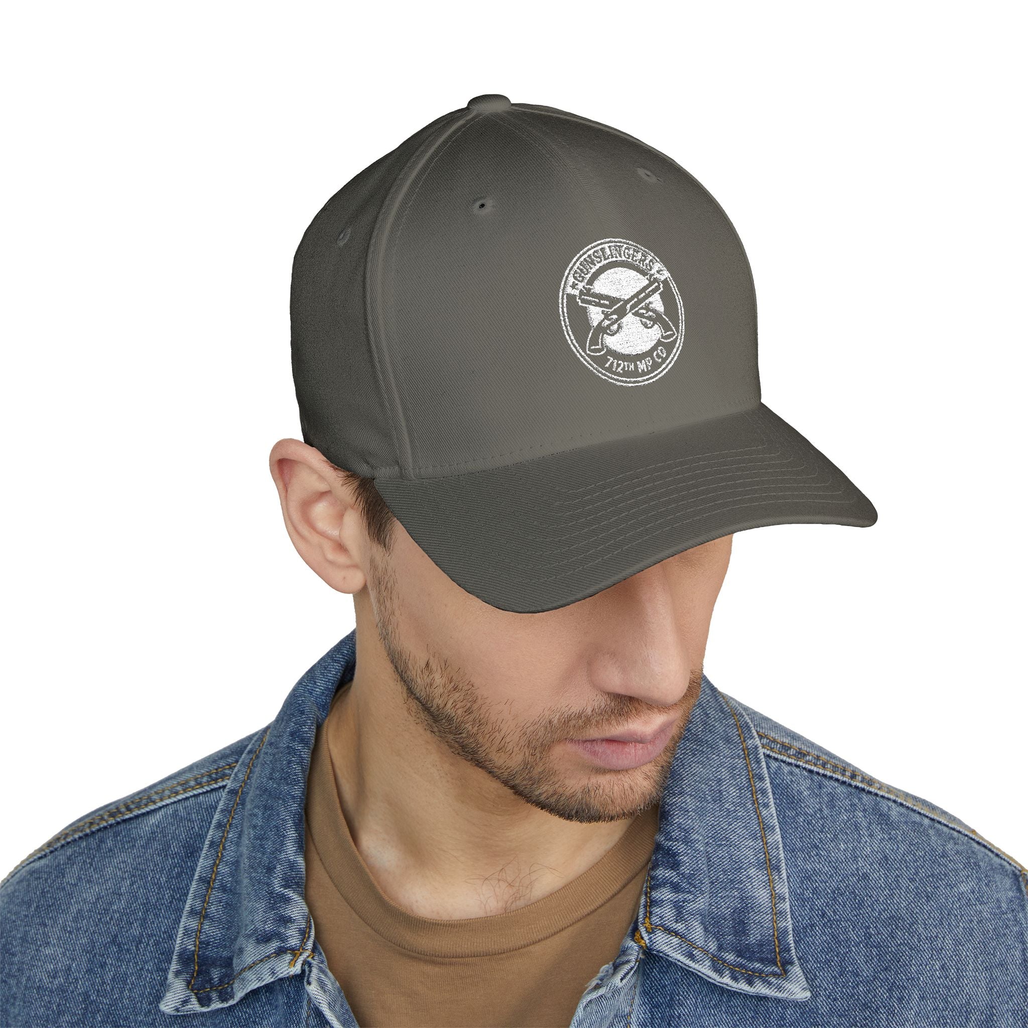 Olive baseball cap with circular white embroidered badge on front