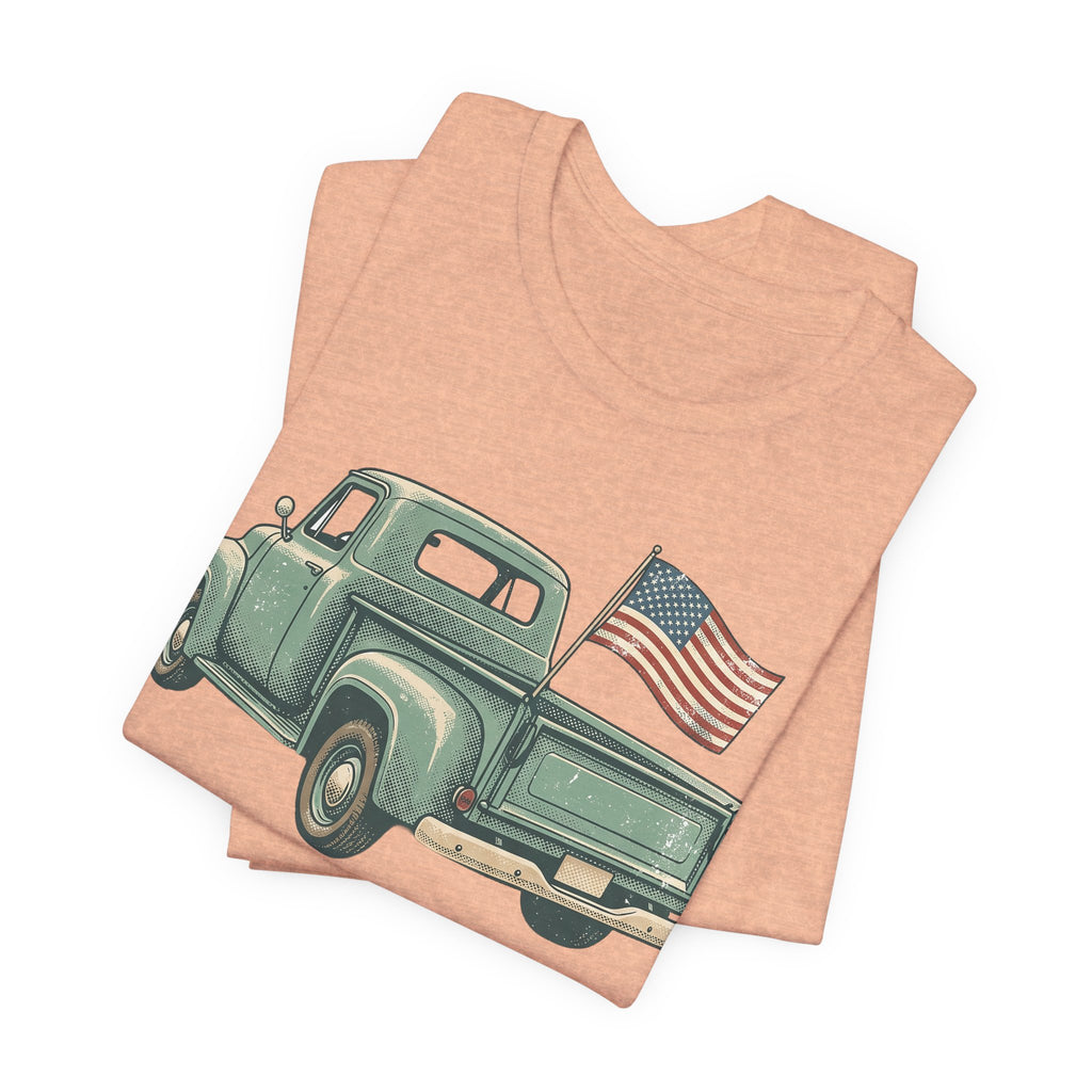 Peach T-shirt with green vintage pickup truck and U.S. flag graphic on front