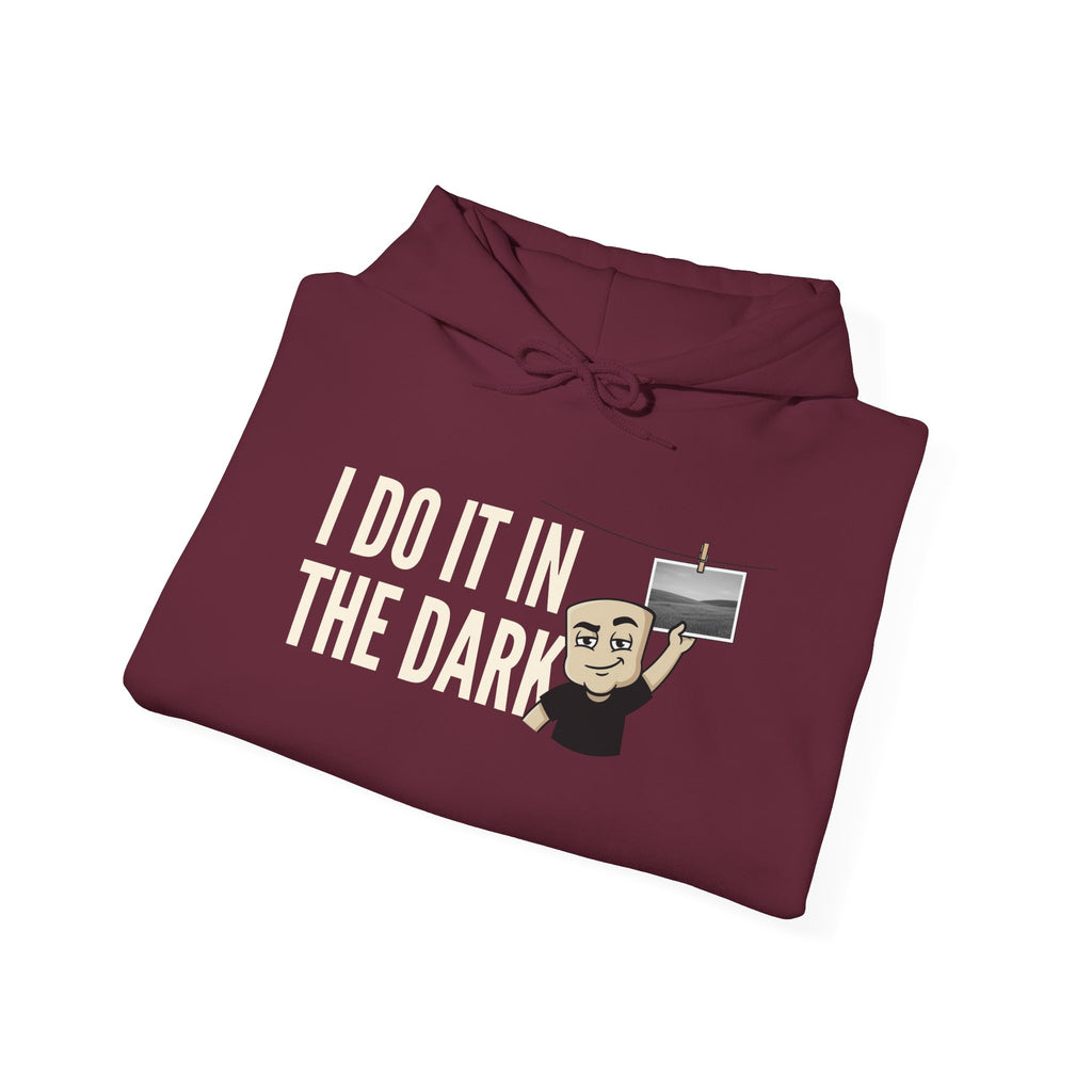 Maroon hoodie with “I DO IT IN THE DARK” text and character graphic on front