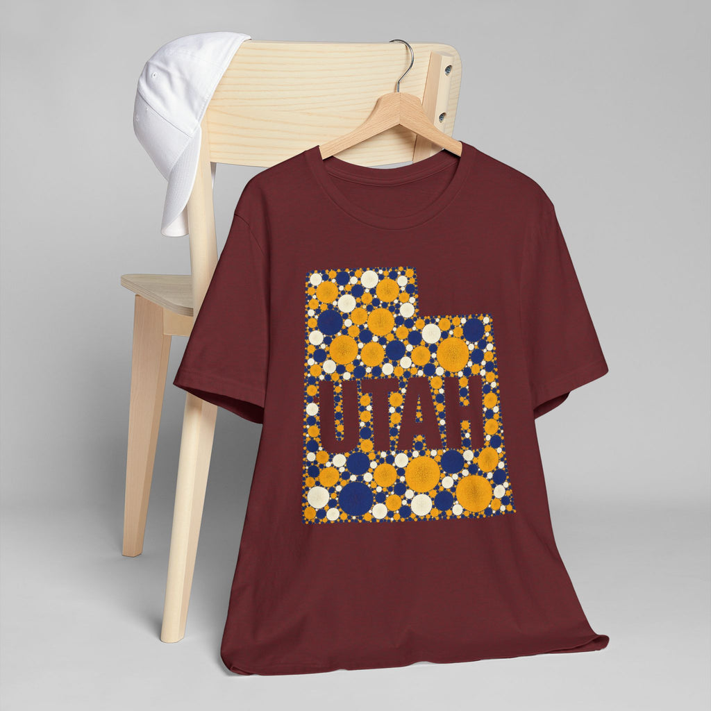 Maroon crewneck t-shirt with blue and gold polka-dot Utah map graphic