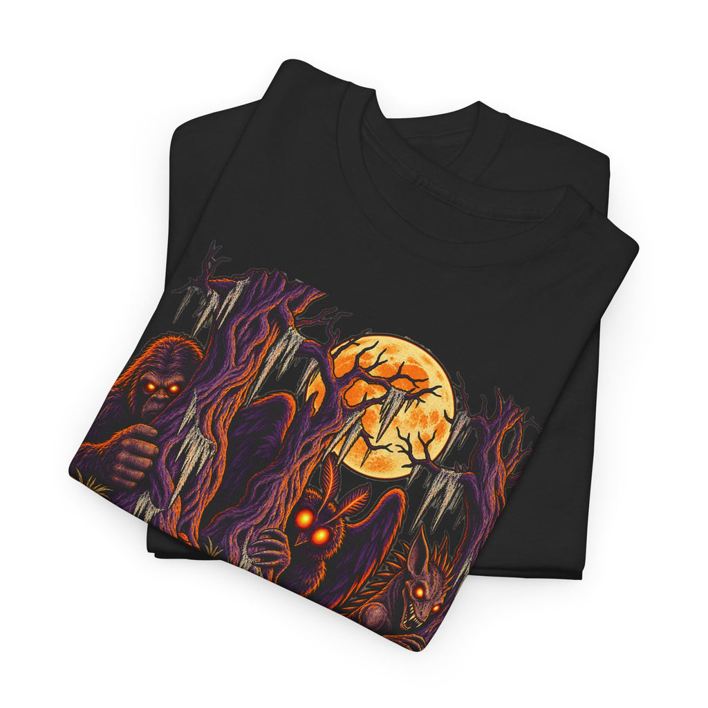 Black Halloween monster graphic T-shirt with haunted forest scene and glowing eyes.