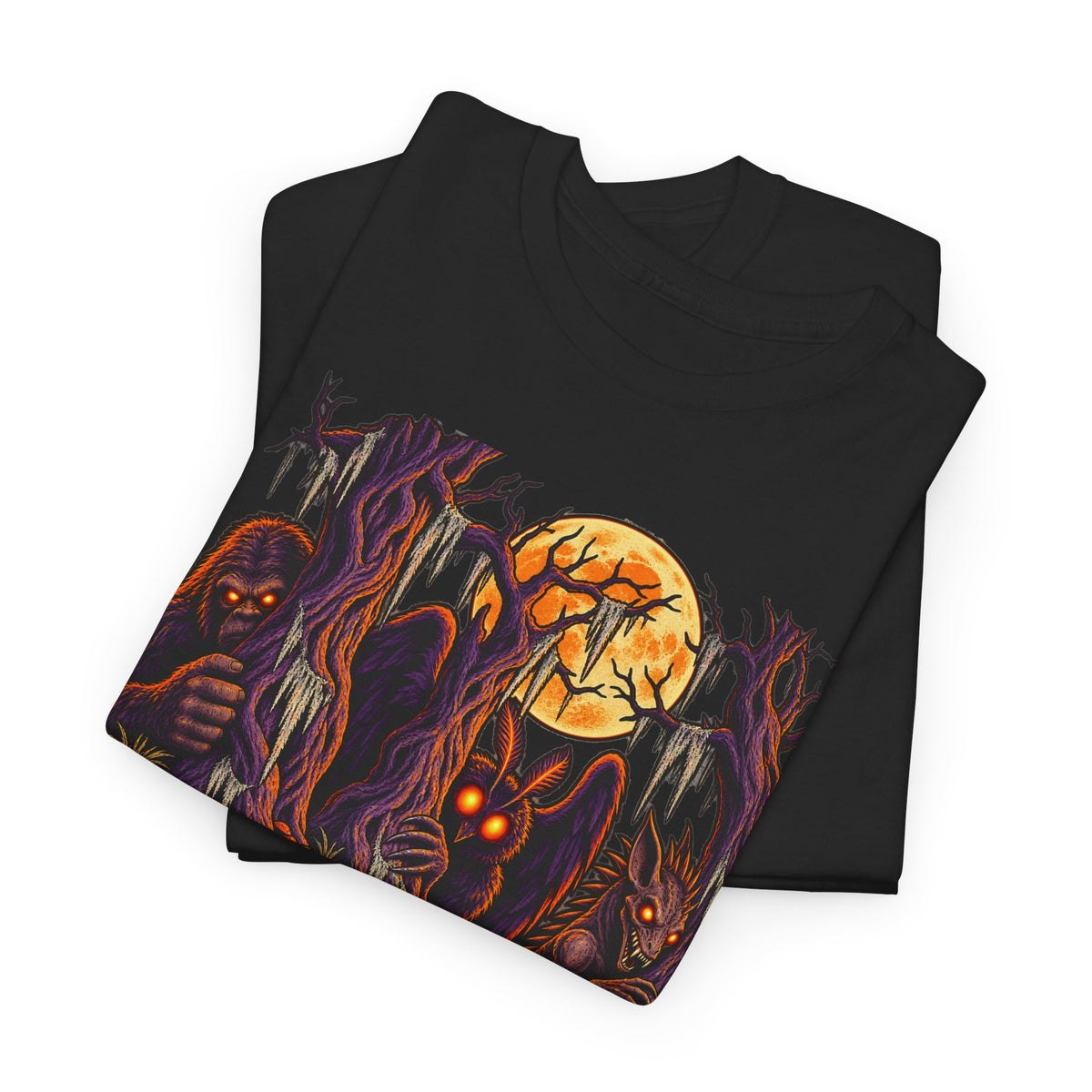 Black Halloween monster graphic T-shirt with haunted forest scene and glowing eyes.