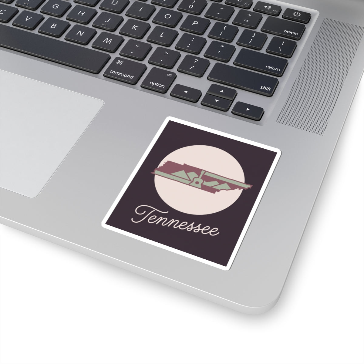 Tennessee decal sticker placed on laptop keyboard with “Tennessee” text