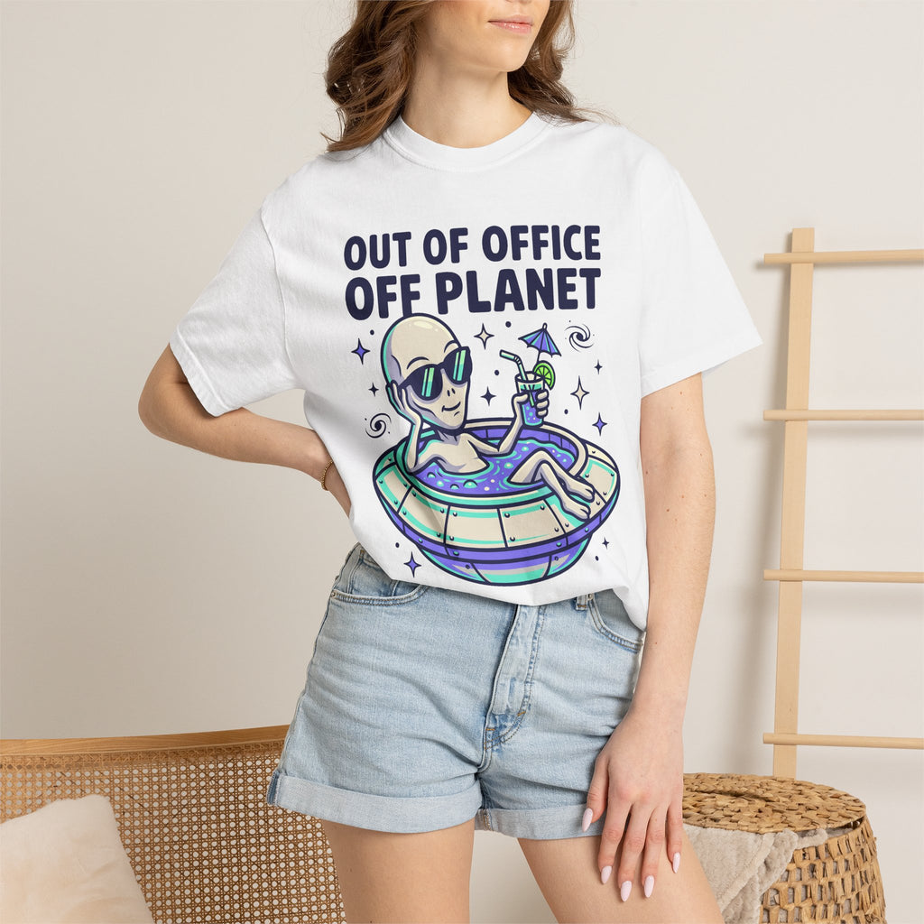 White T-shirt worn by model, alien floatie graphic with 'OUT OF OFFICE OFF PLANET'