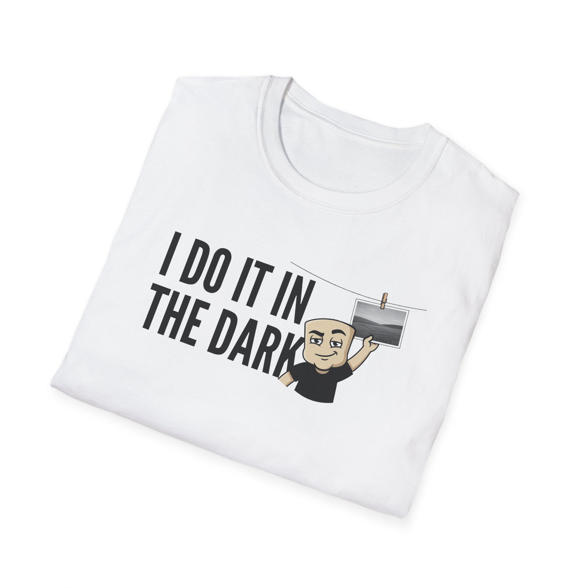 White T-shirt with "I DO IT IN THE DARK" graphic and cartoon photographer