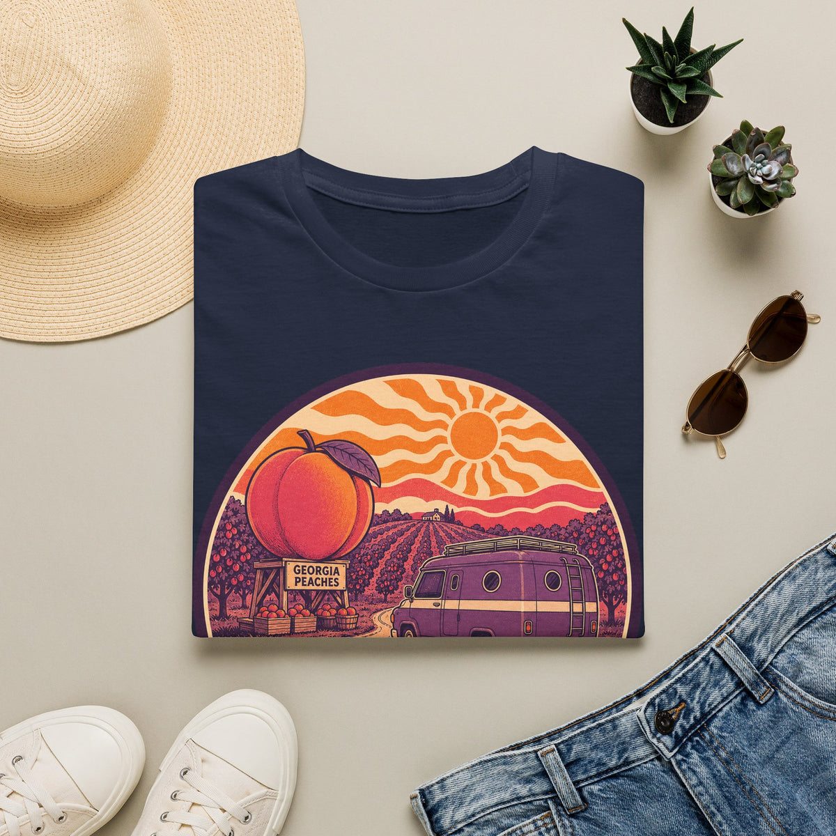 Navy unisex crewneck T-shirt with retro peach sunset camper van graphic on front.